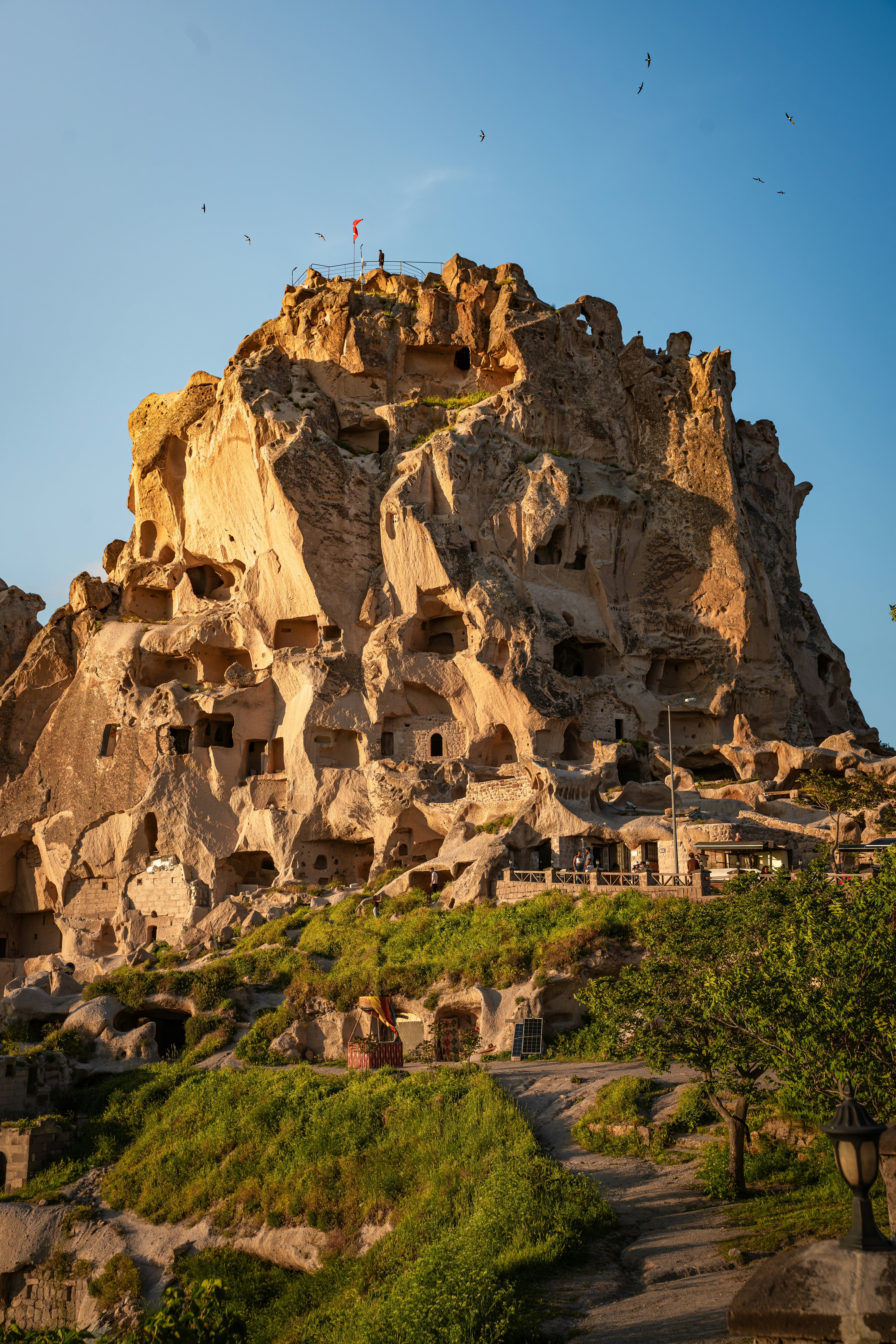 Uchisar Castle carved into a volcanic rock formation in Cappadocia, Turkey