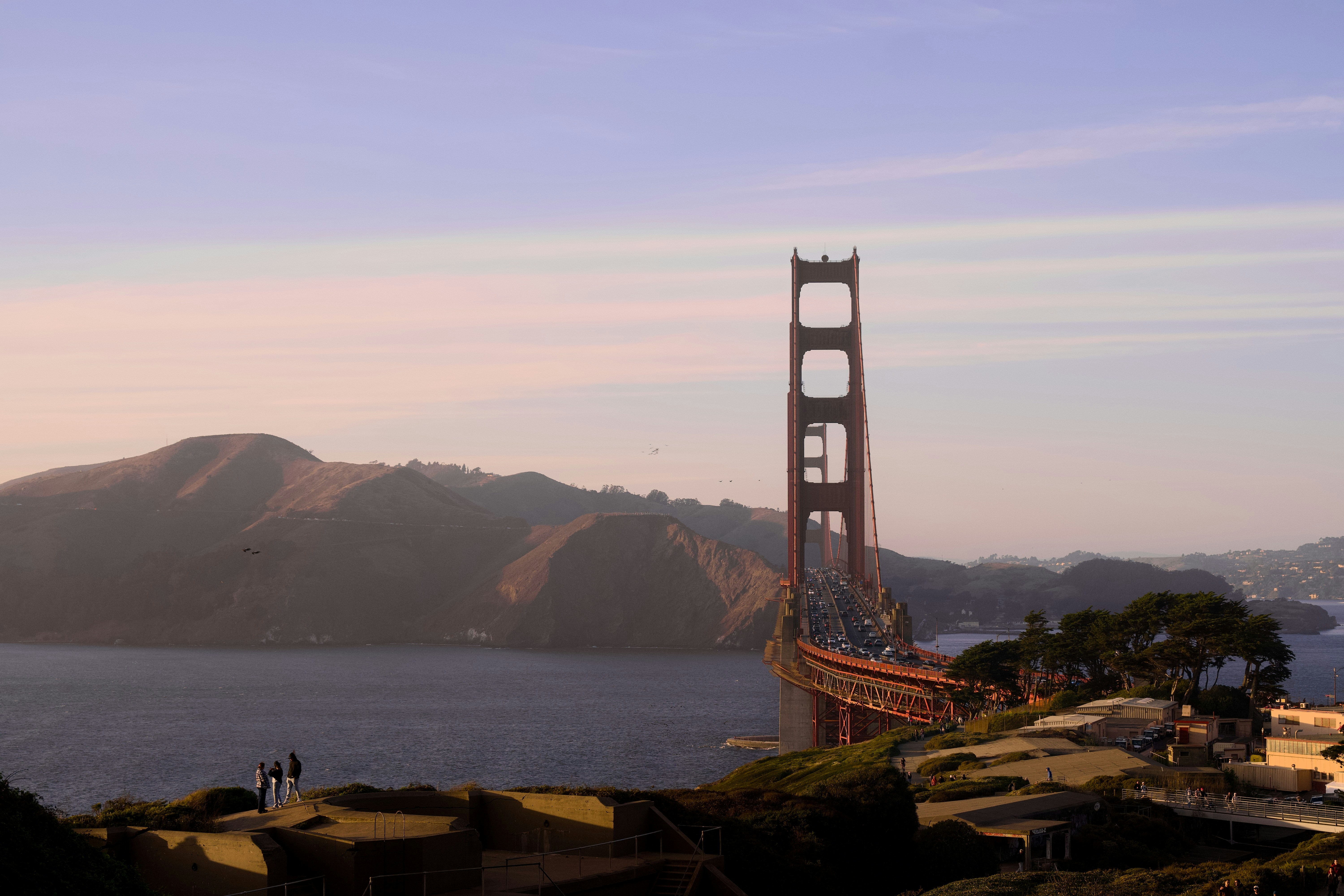 The Golden Gate Bridge spanning the bay with hills in San Francisco