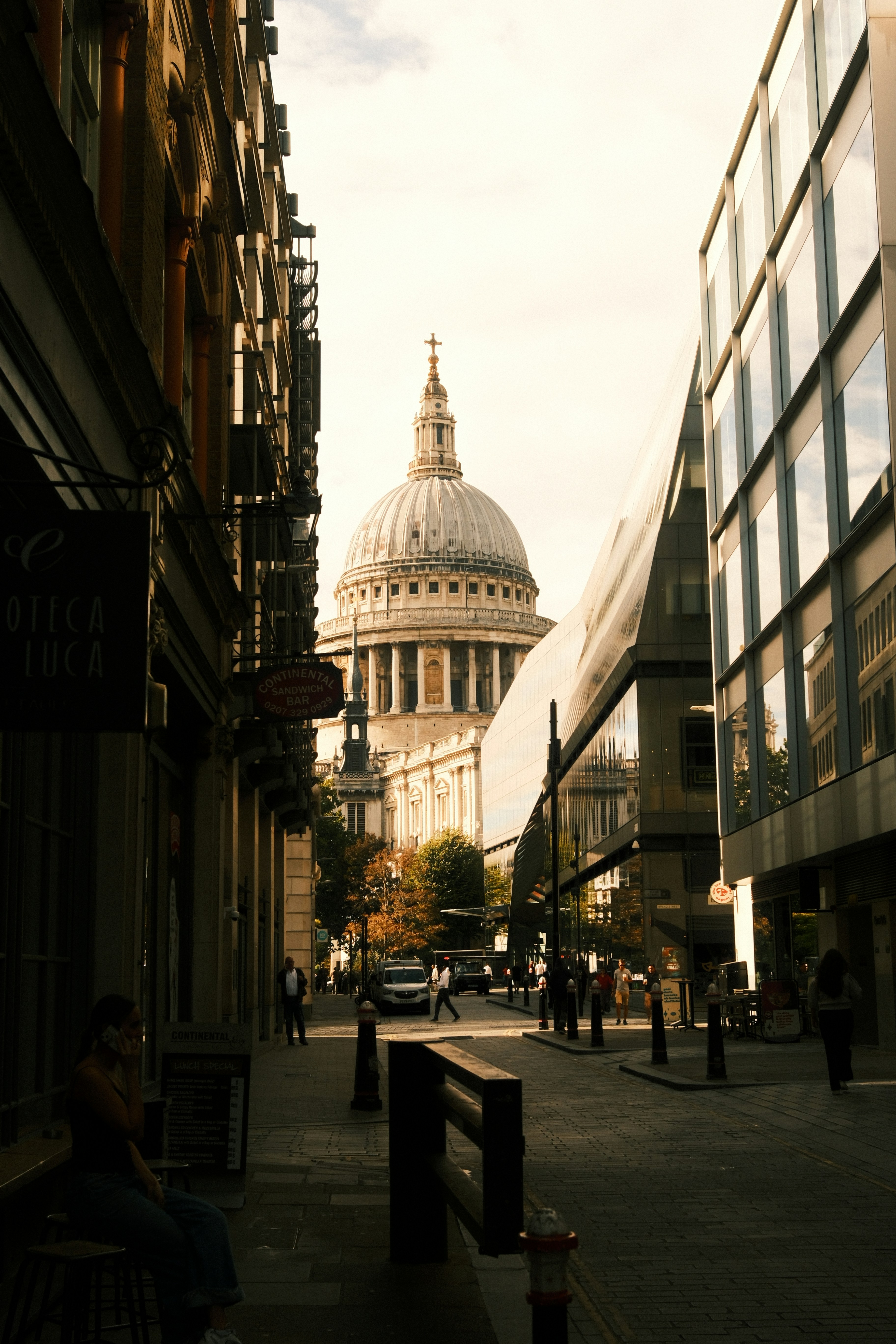 St Paul's Cathedral dome at the end of a narrow street in London