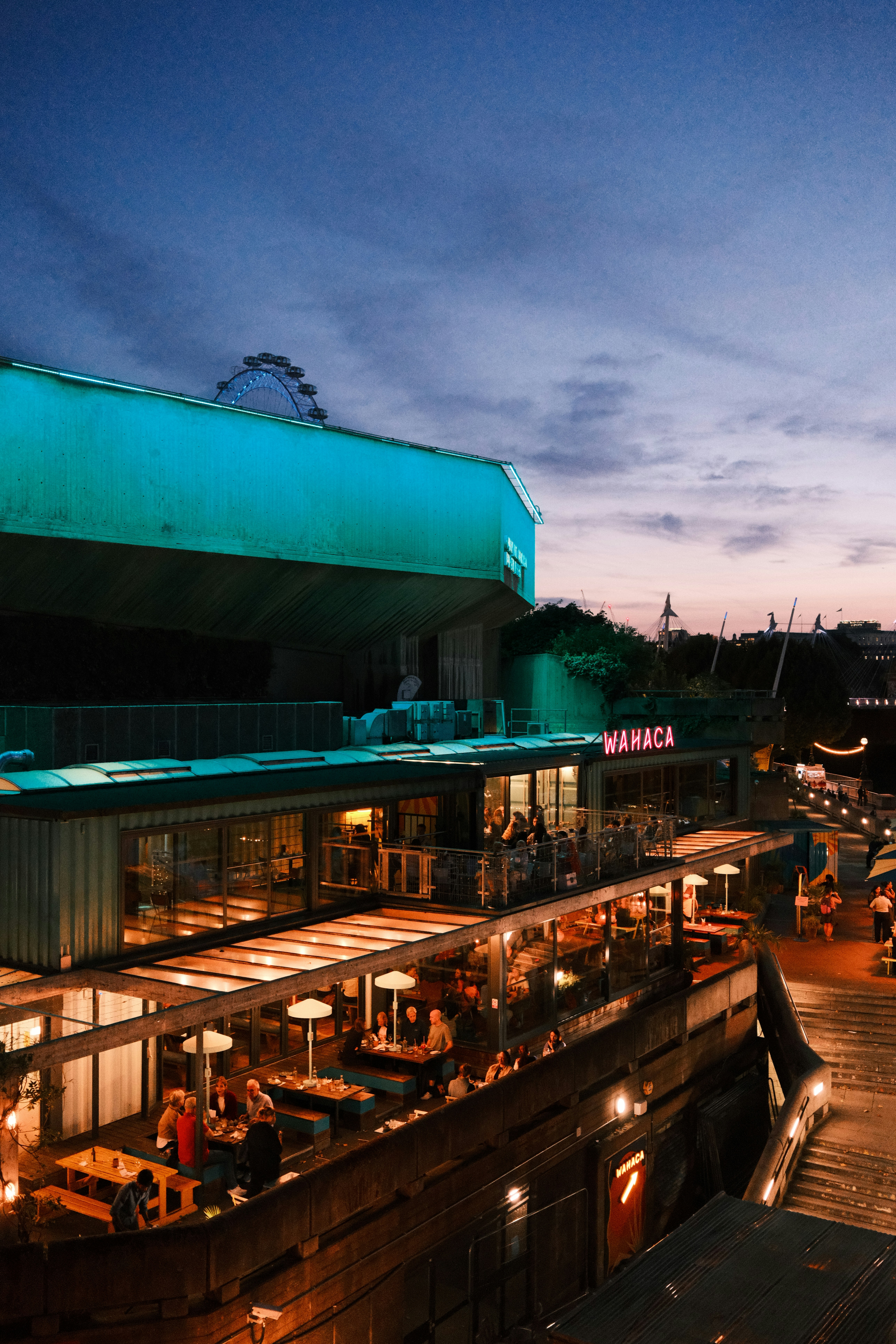The Wahaca restaurant on the South Bank in London with the London Eye behind