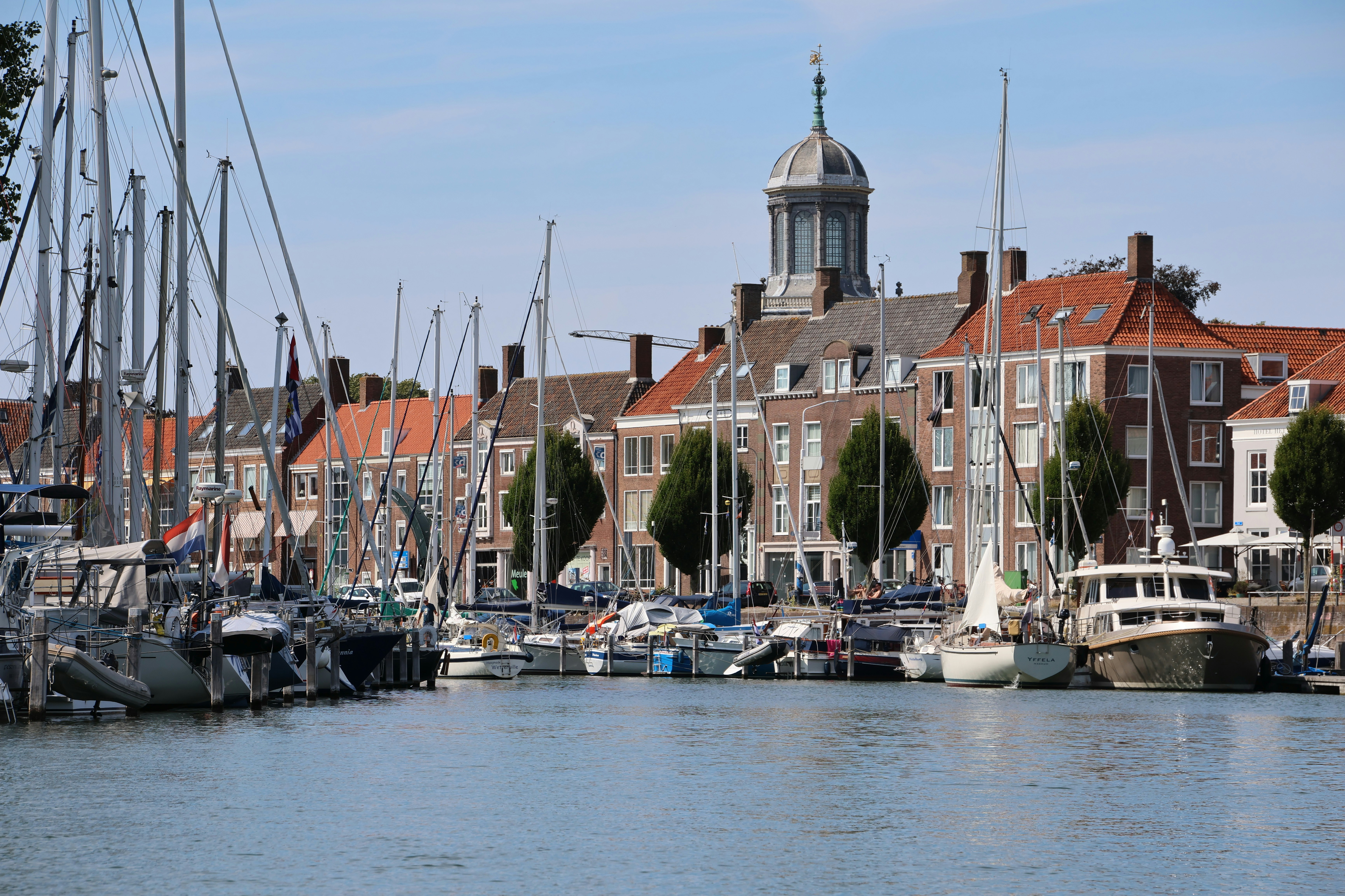 Sailboats and motor yachts moored at a harbor in Hoorn, Netherlands