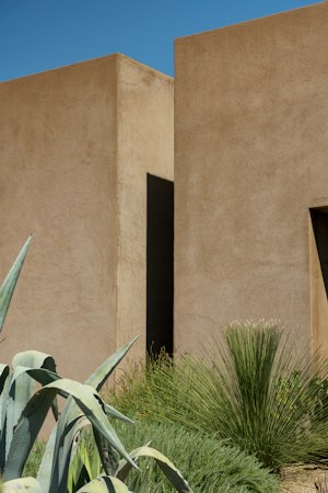 Tan stucco walls and desert plants under a clear blue sky, a familiar sight on Las Vegas Valley homes for sale this fall