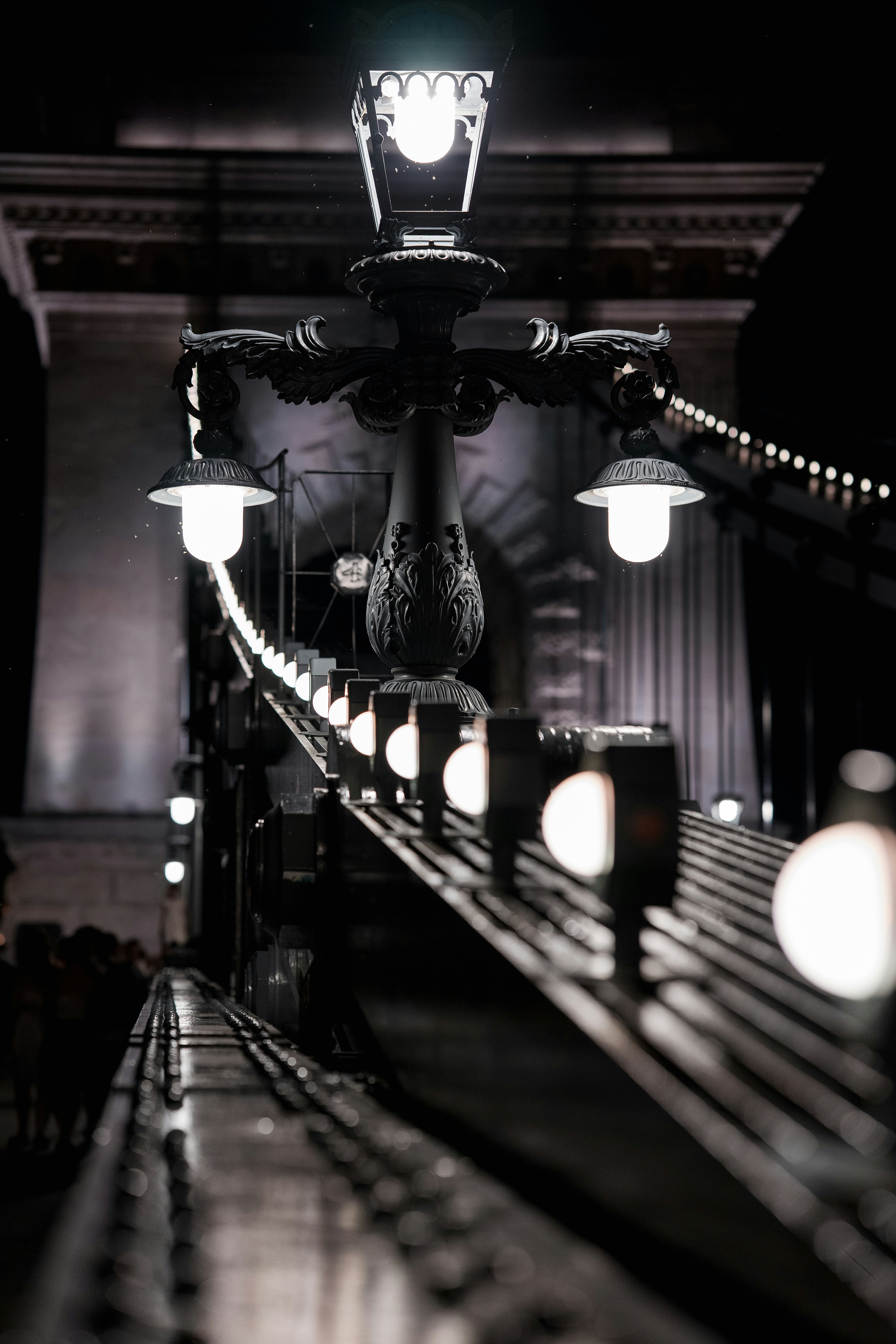 An ornate street lamp on the Széchenyi Chain Bridge in Budapest at night