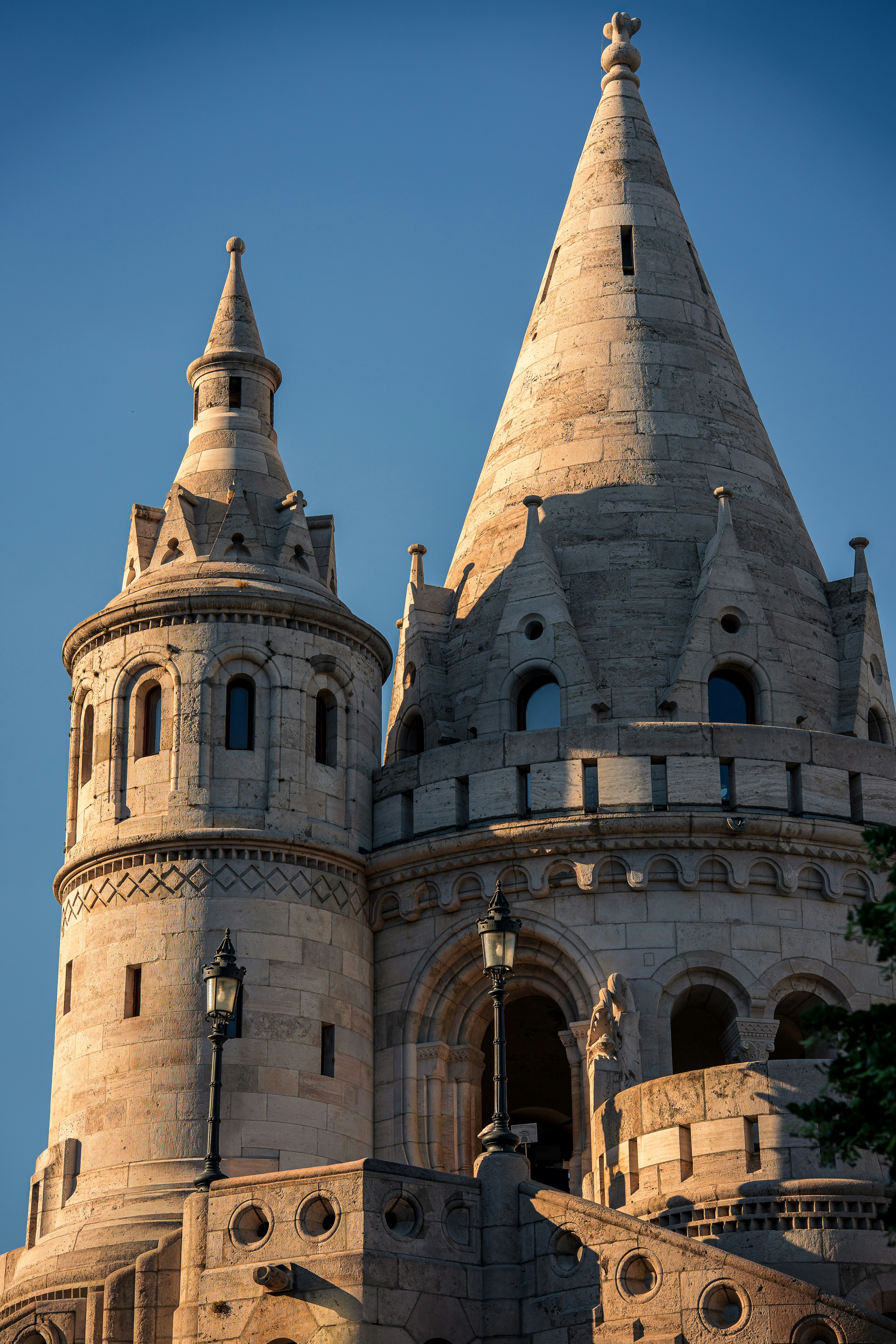 Stone towers of Fisherman's Bastion in Budapest under a clear blue sky