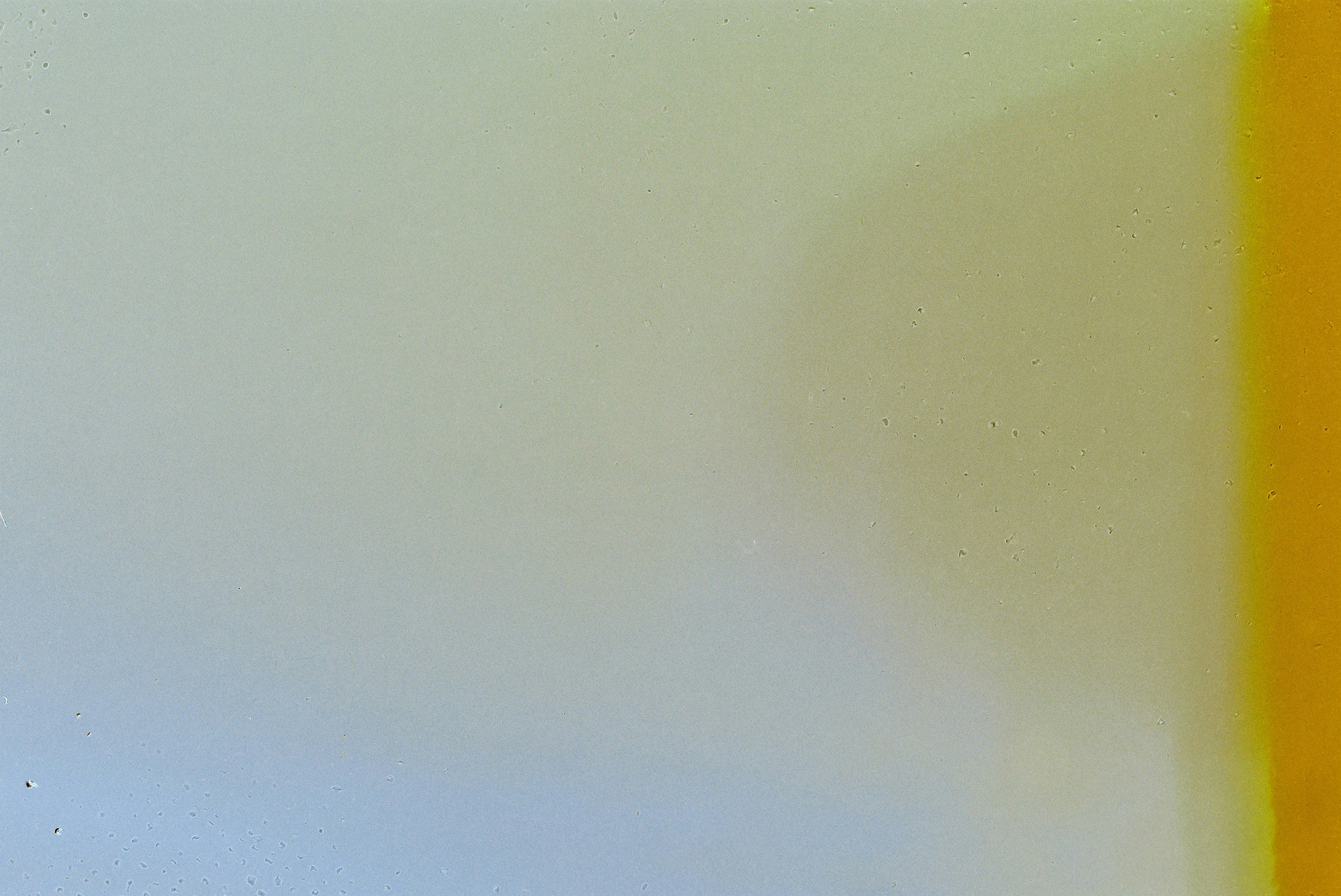 A soft gradient shifting from pale blue to a vibrant yellow edge
