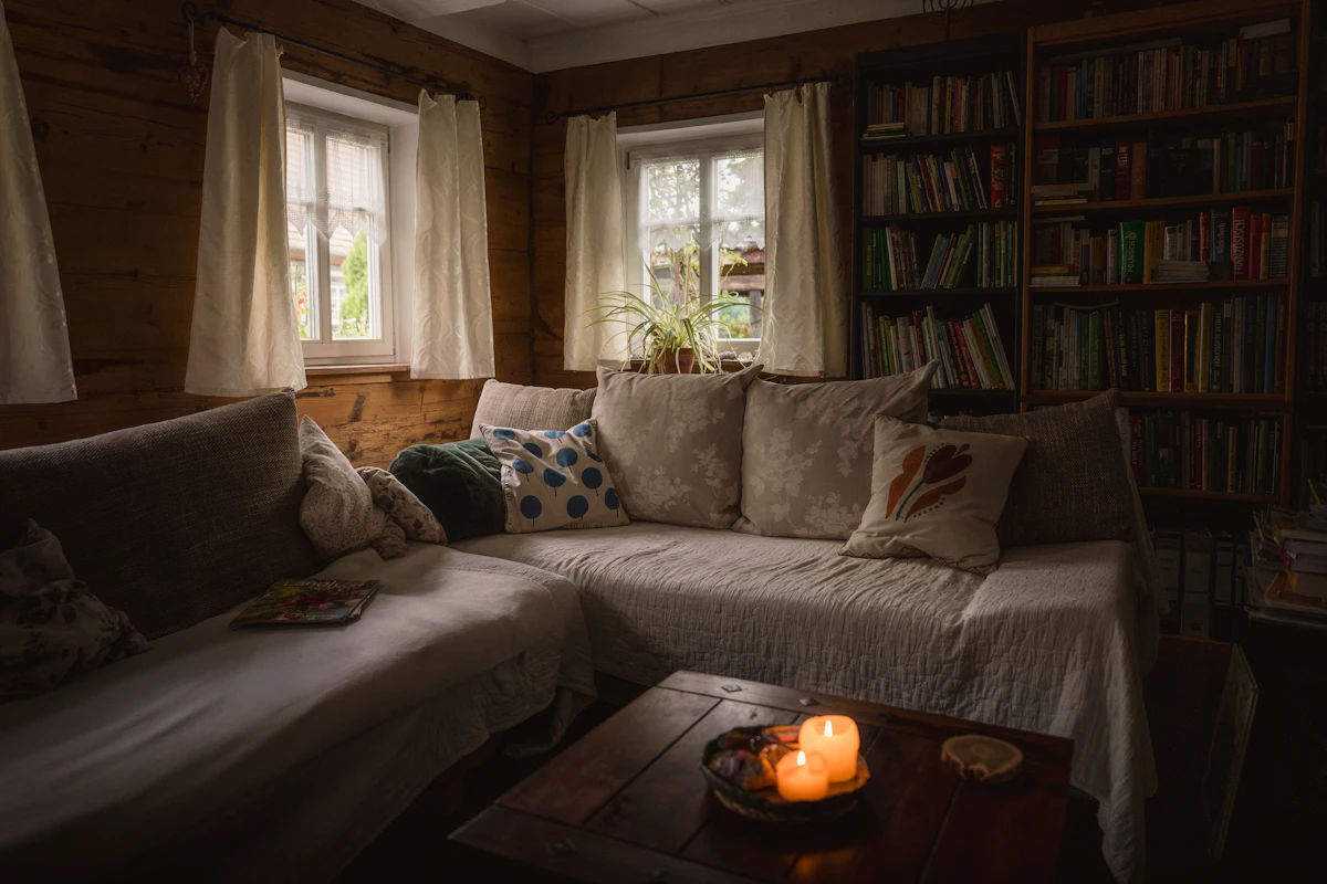 Gentle warm accent glow softening a small lounge corner