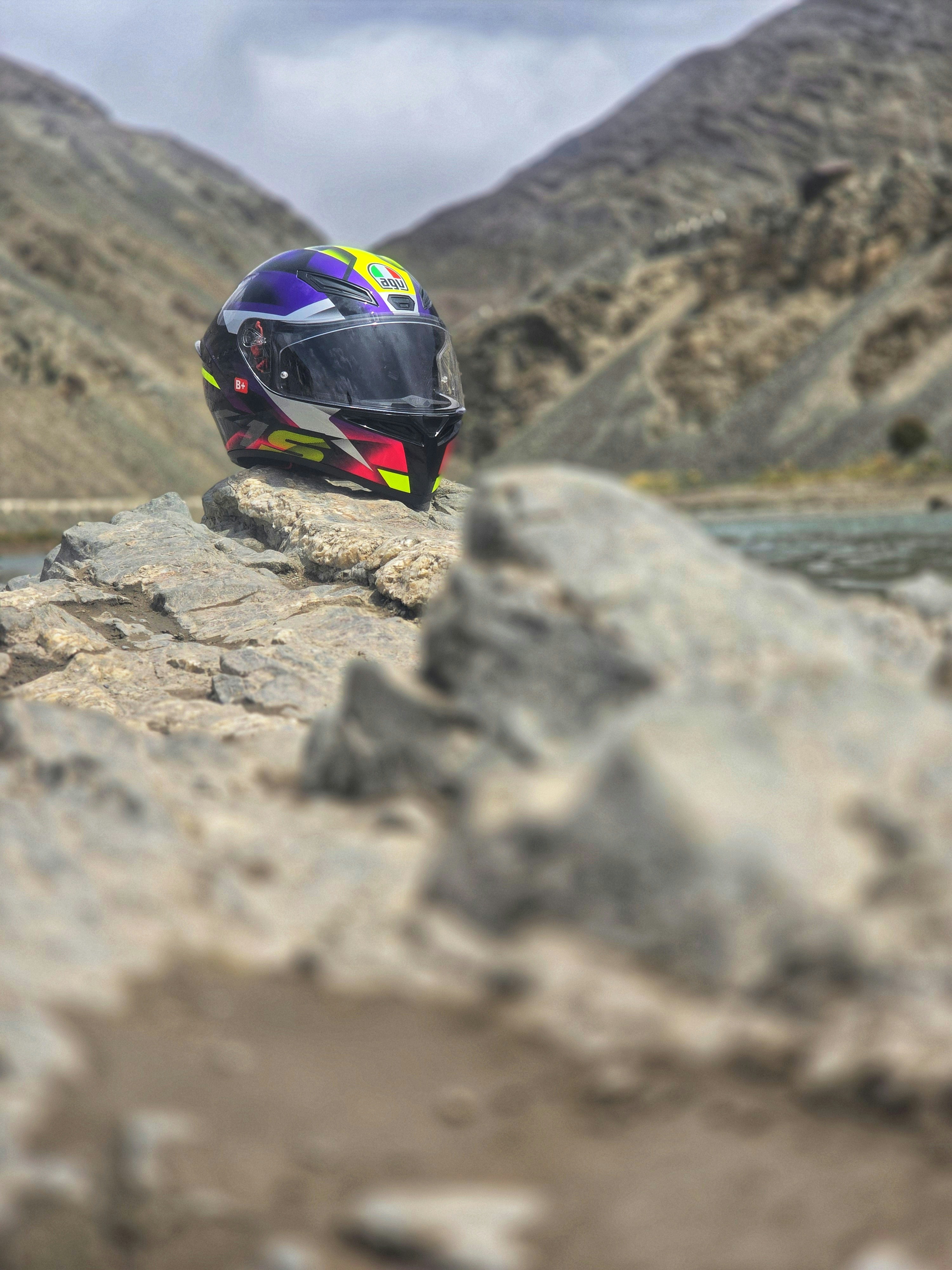 Motorcycle helmet on rocky mountain outcrop - Free Photo on Unsplash