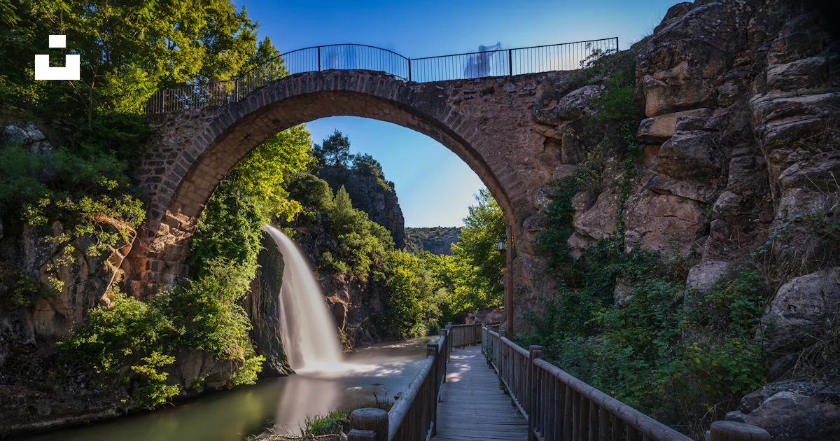 High Resolution Bridge Picture Stone arch bridge over waterfall - Free Photo on Unsplash