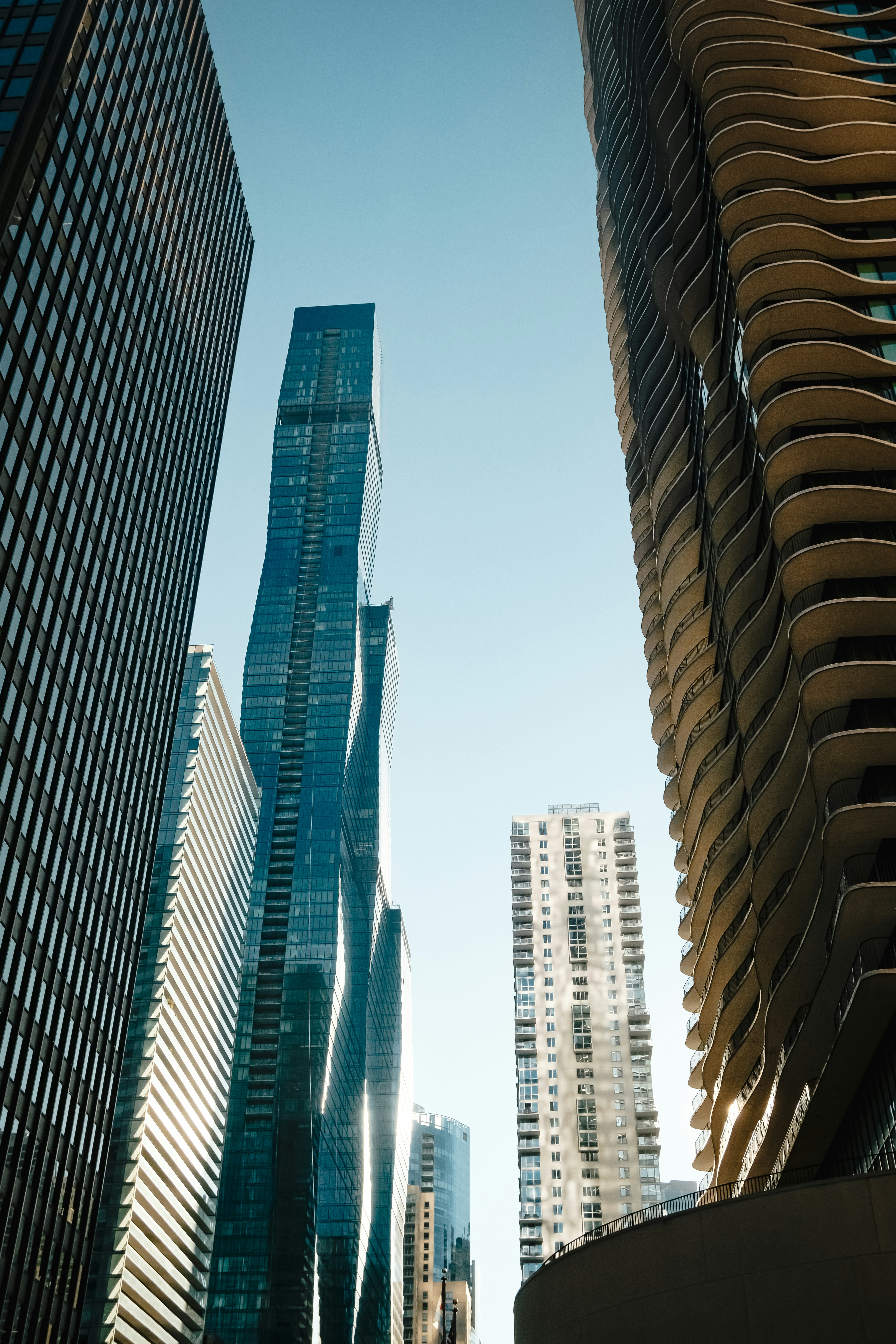 Low angle view of modern skyscrapers with glass and concrete facades in Chicago