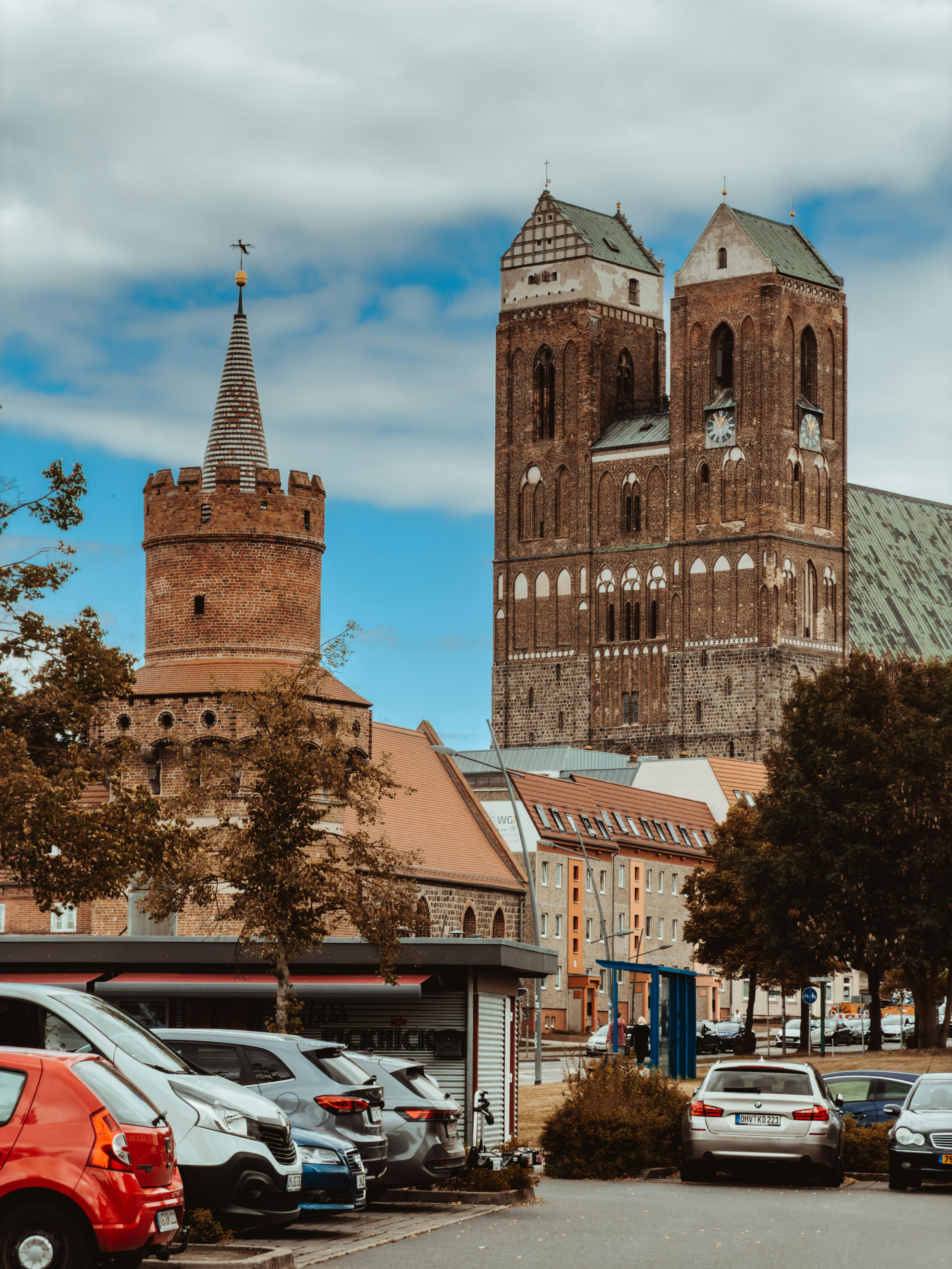 A brick tower and a large gothic church in Wismar, Germany