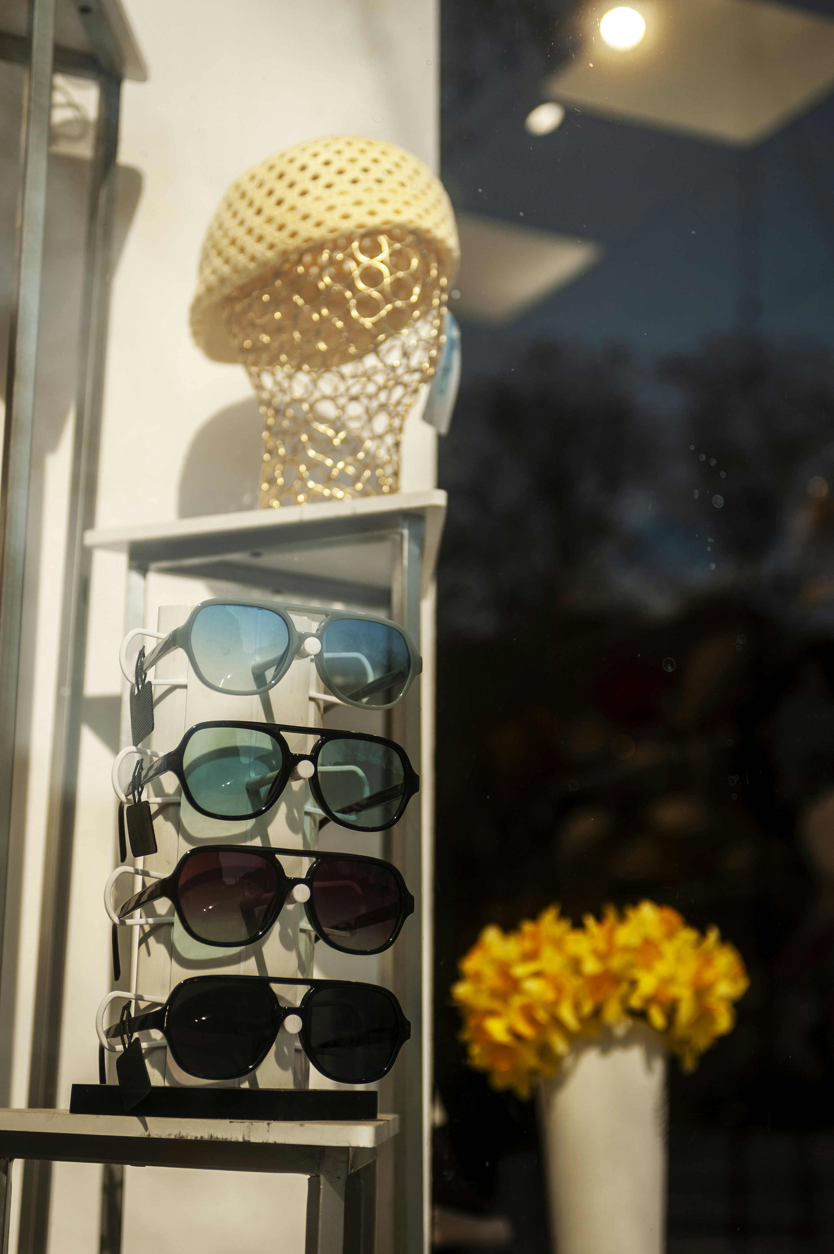 Sunglasses on display stand with hat - Free Photo on Unsplash