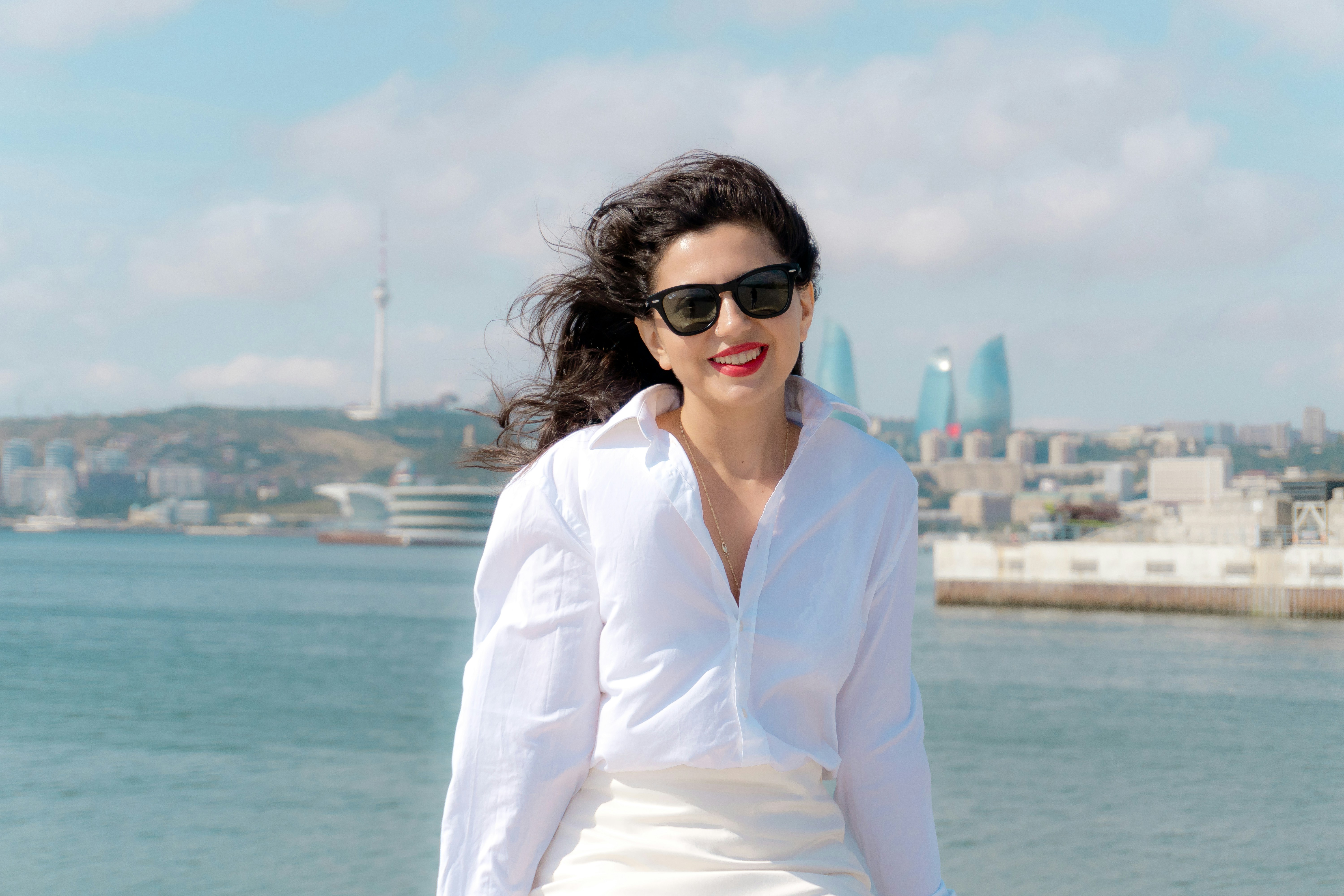 White shirt by the water, wind in the hair