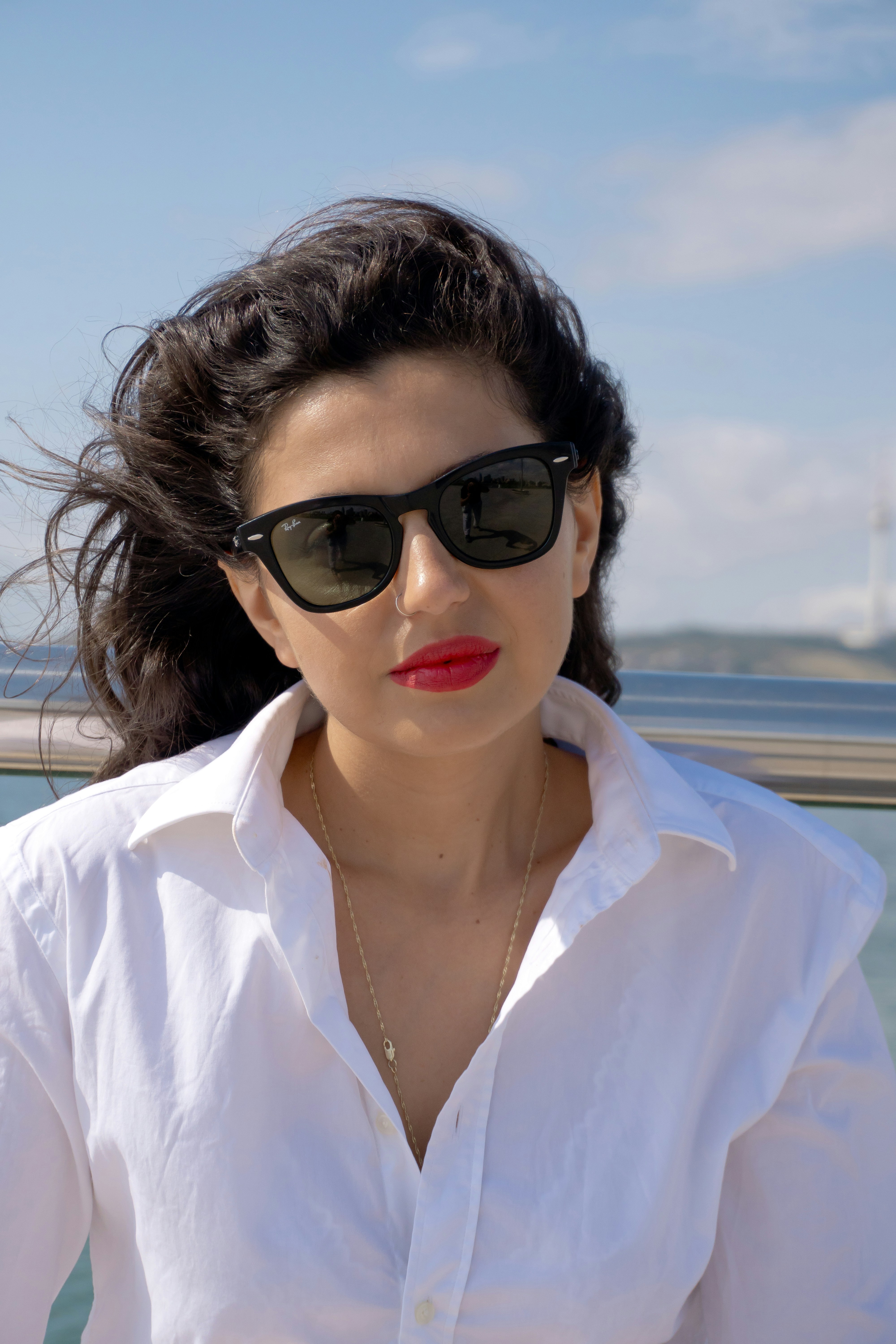 White linen shirt and sunglasses in sea wind