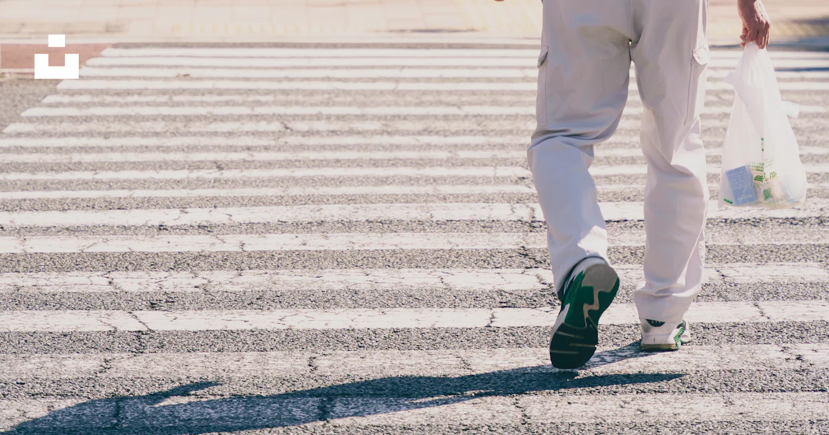 Red Man Safety Sign Older man walking across pedestrian crossing - Free Photo on Unsplash