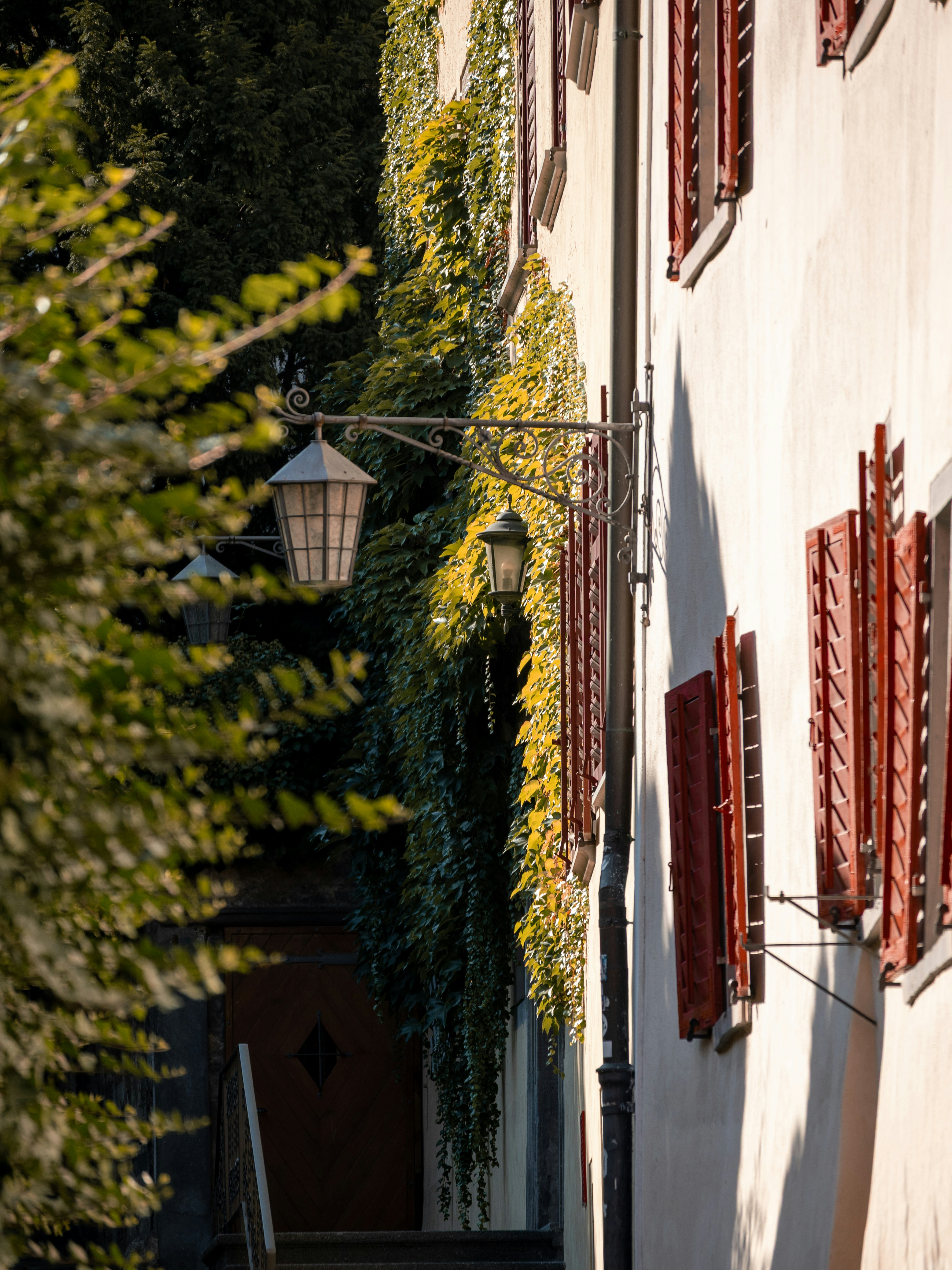 Building wall with red shutters - Free Photo on Unsplash