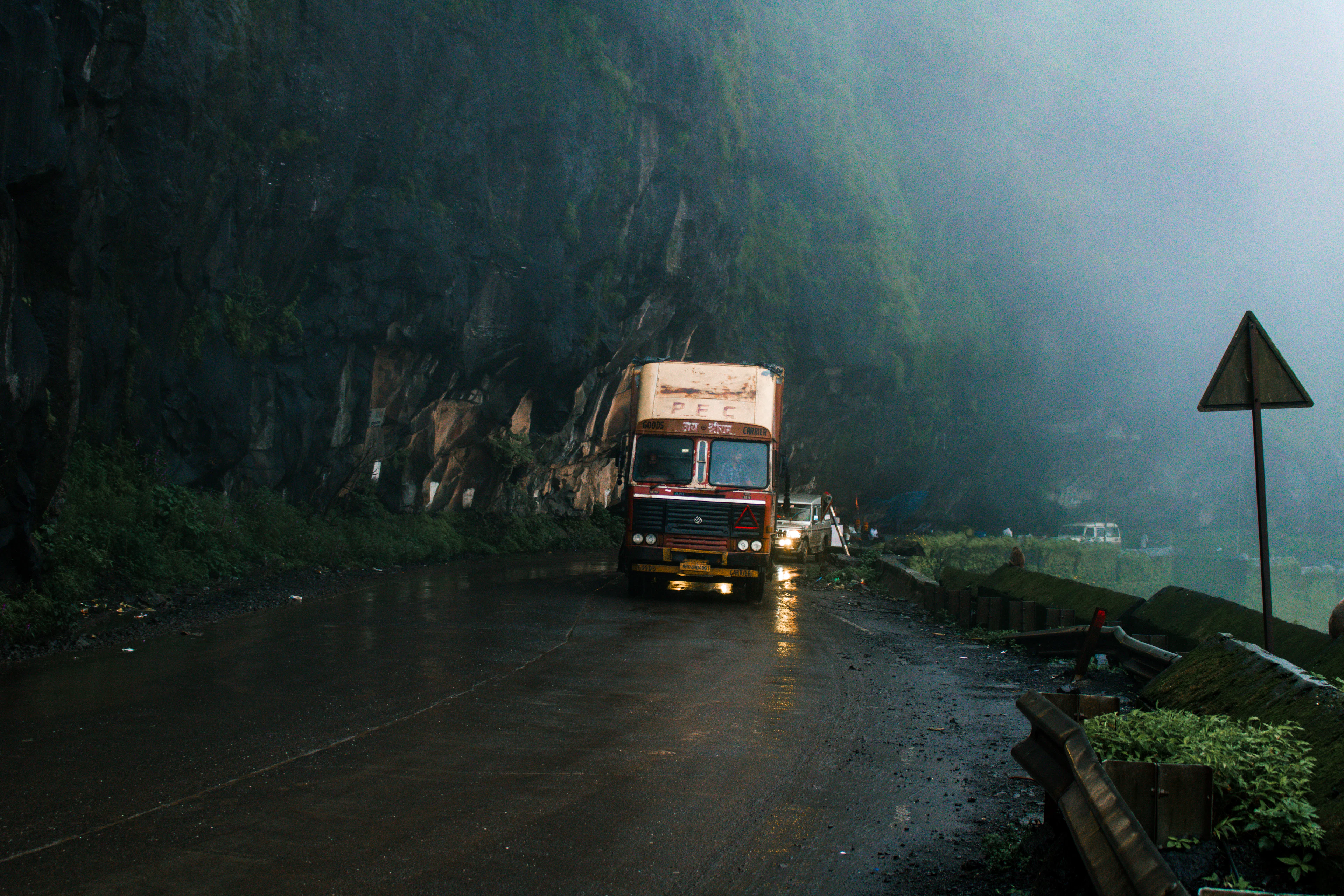 Goods truck on a wet mountain highway in India