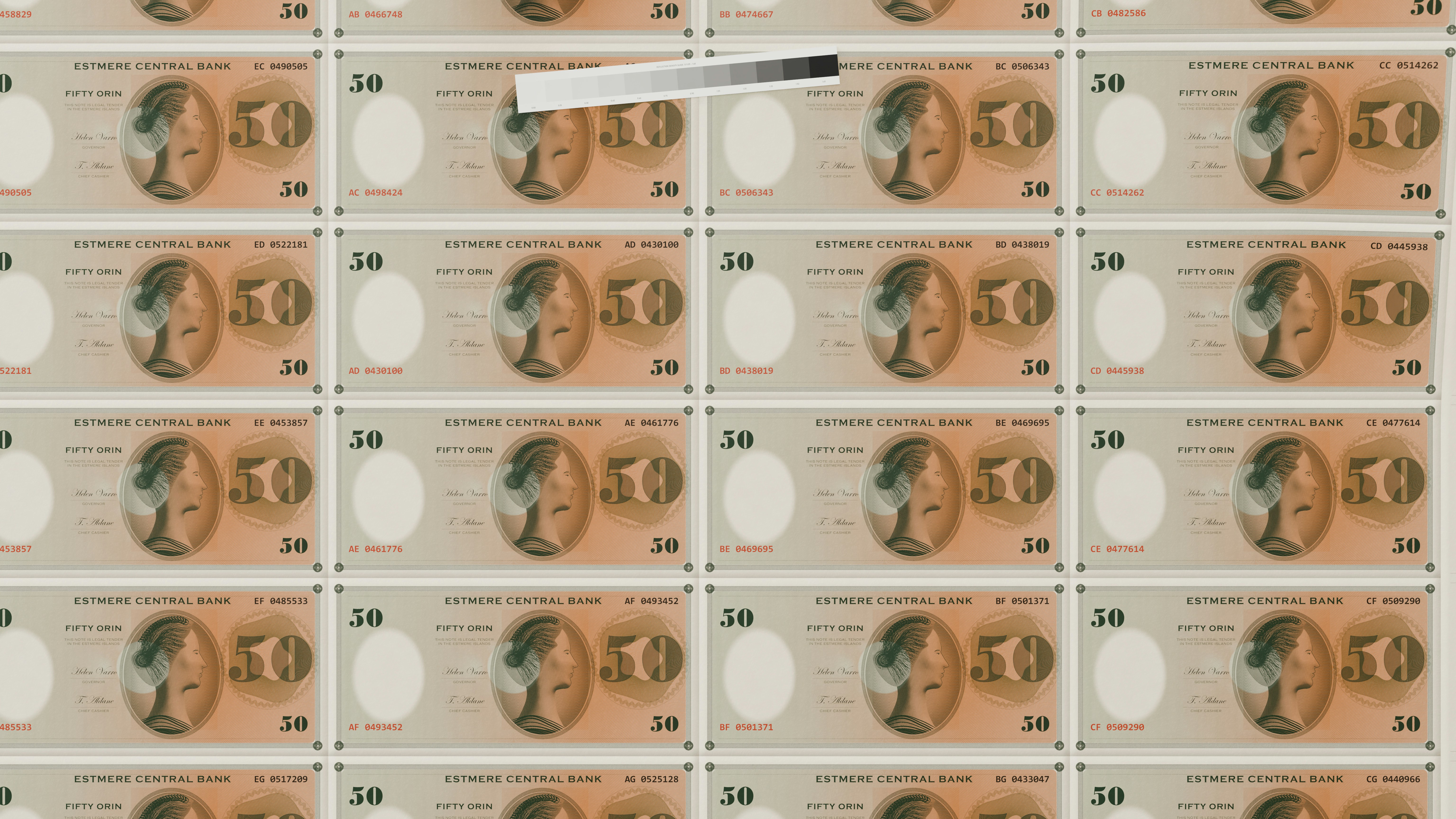 A grid of fifty Orin banknotes with a grayscale color calibration strip