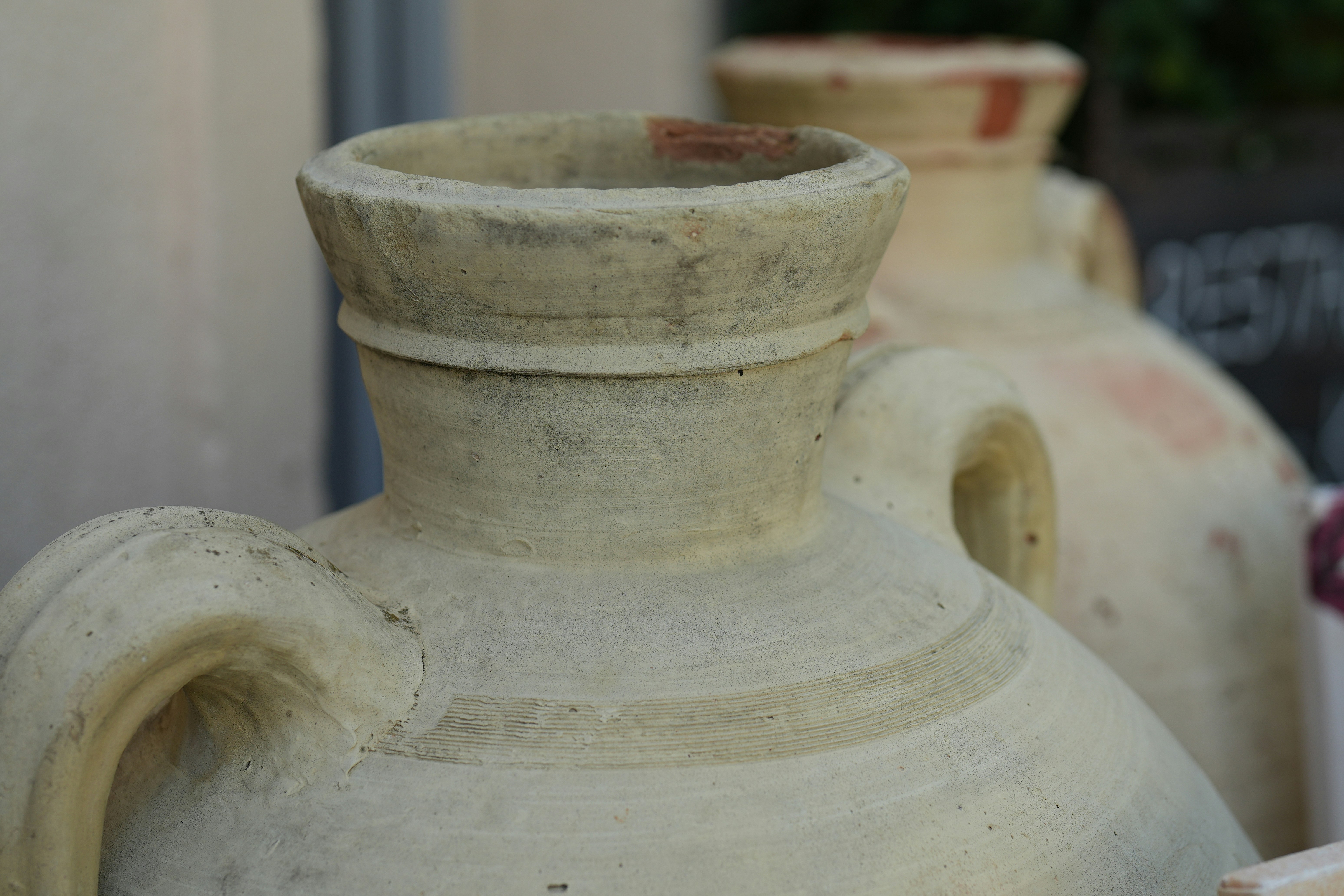 Weathered terracotta amphorae with handles - Free Photo on Unsplash