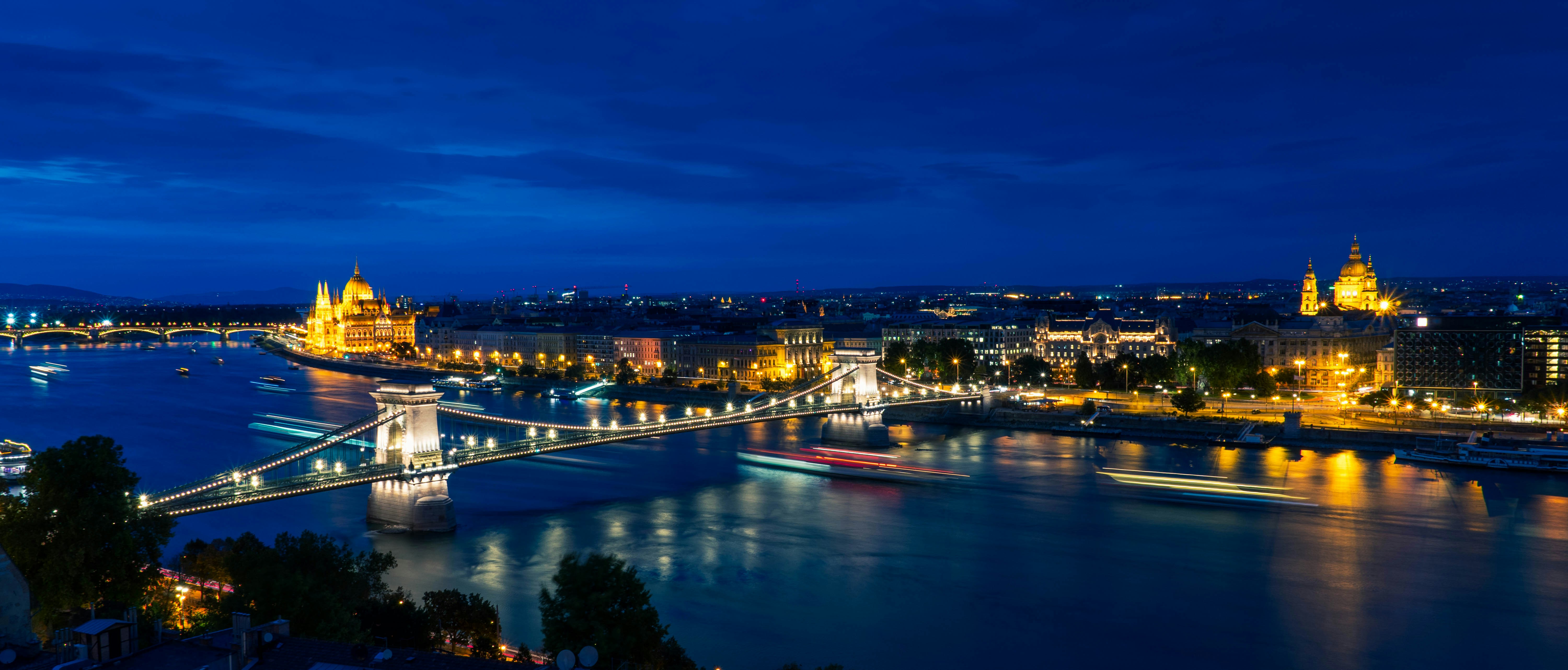 The illuminated Széchenyi Chain Bridge over the Danube river in Budapest at night