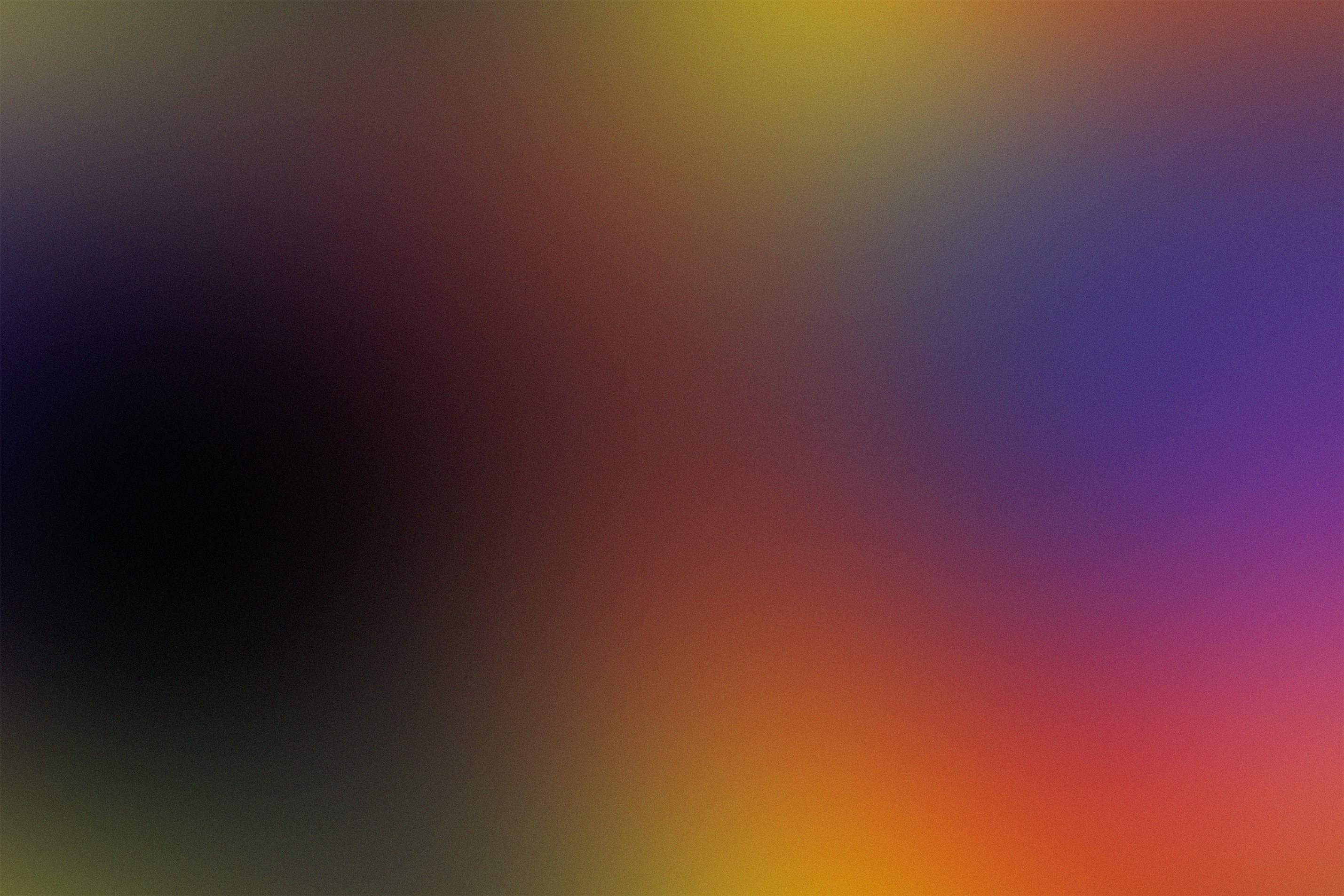 A smooth gradient shifting from deep black to vibrant purple, orange, and yellow