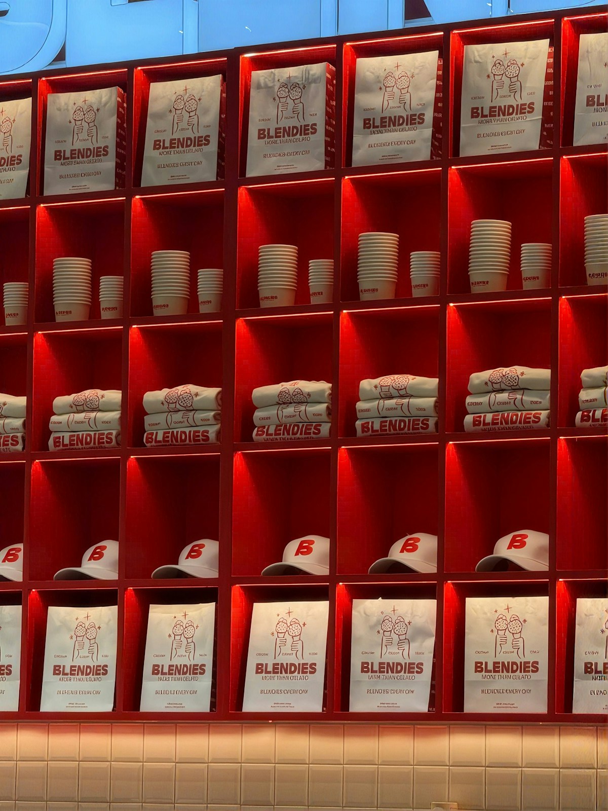 Branded bags, cups, folded shirts and caps for corporate merchandise