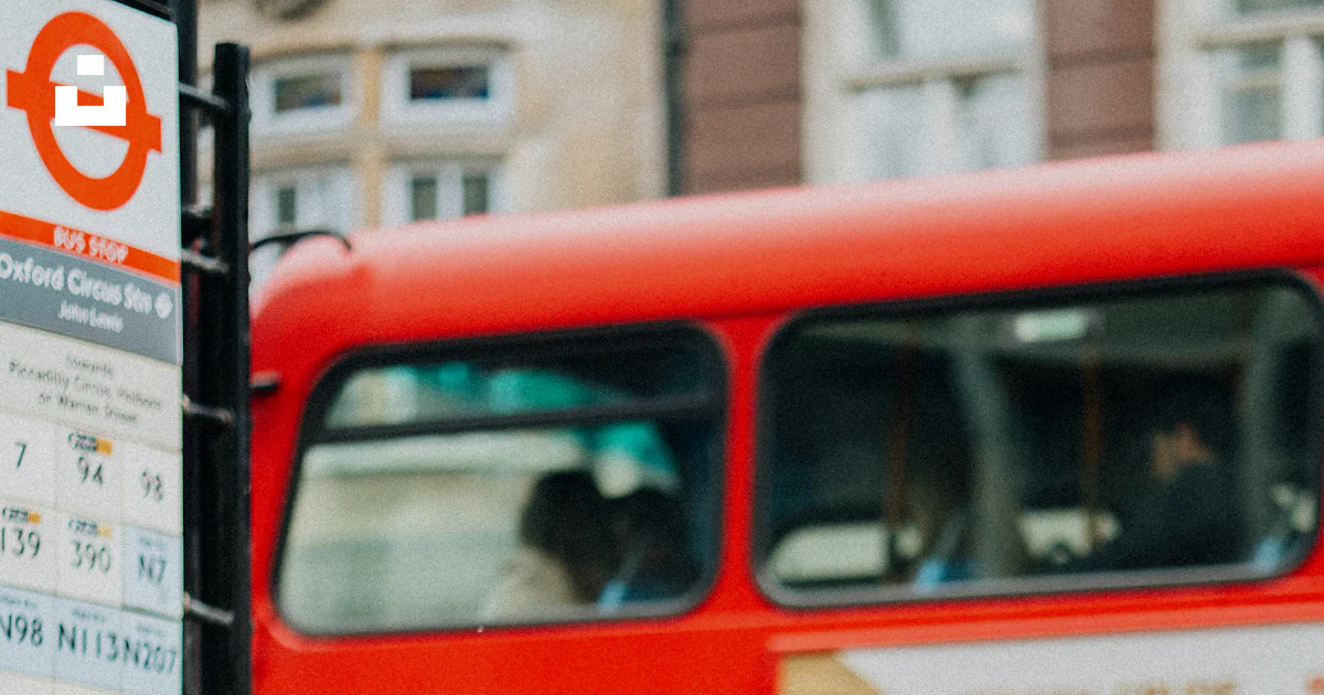Red Man Safety Sign Man waiting at London bus stop - Free Photo on Unsplash