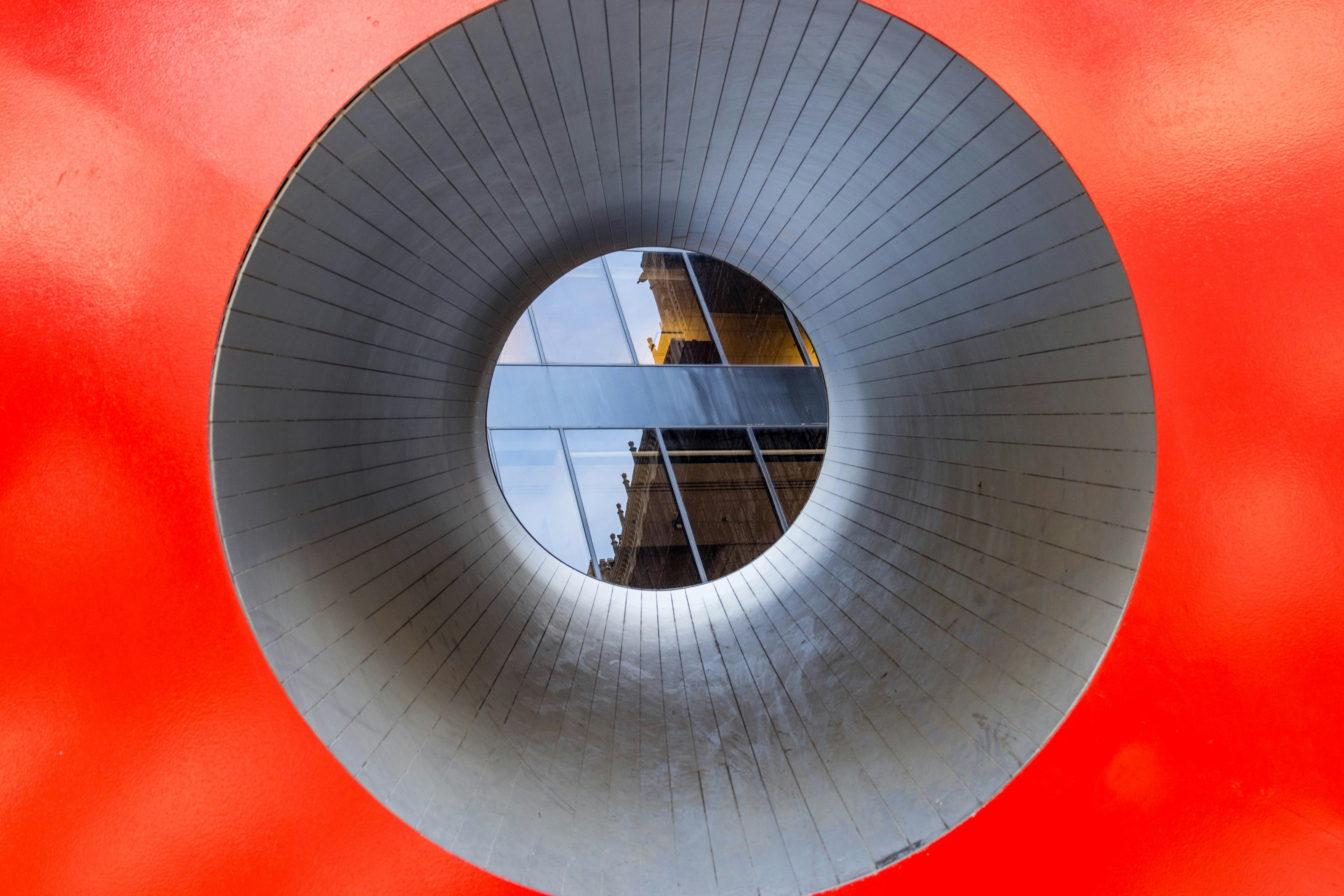Circular opening in red wall - Free Photo on Unsplash