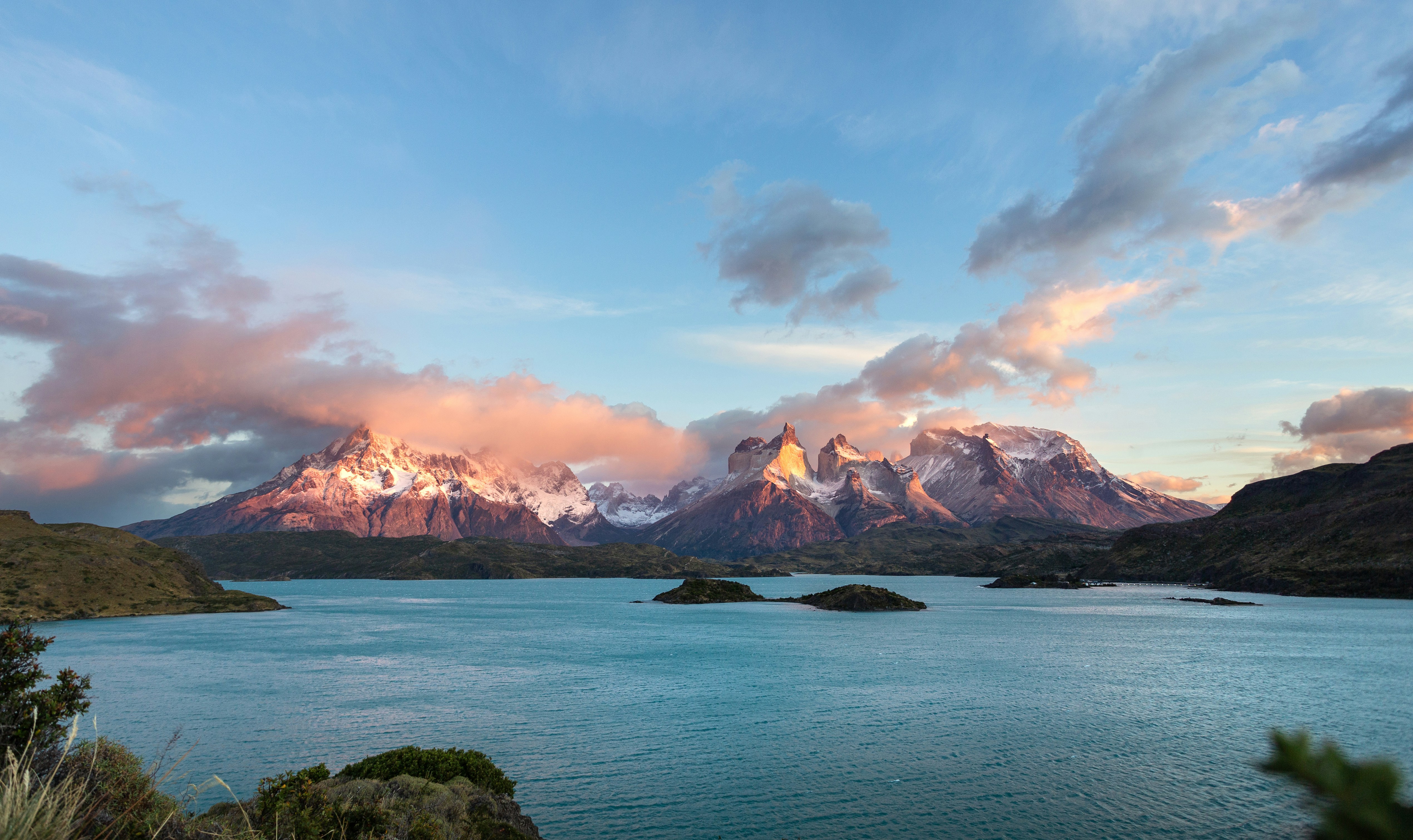 Snowy peaks of Torres del Paine above a turquoise lake in Patagonia