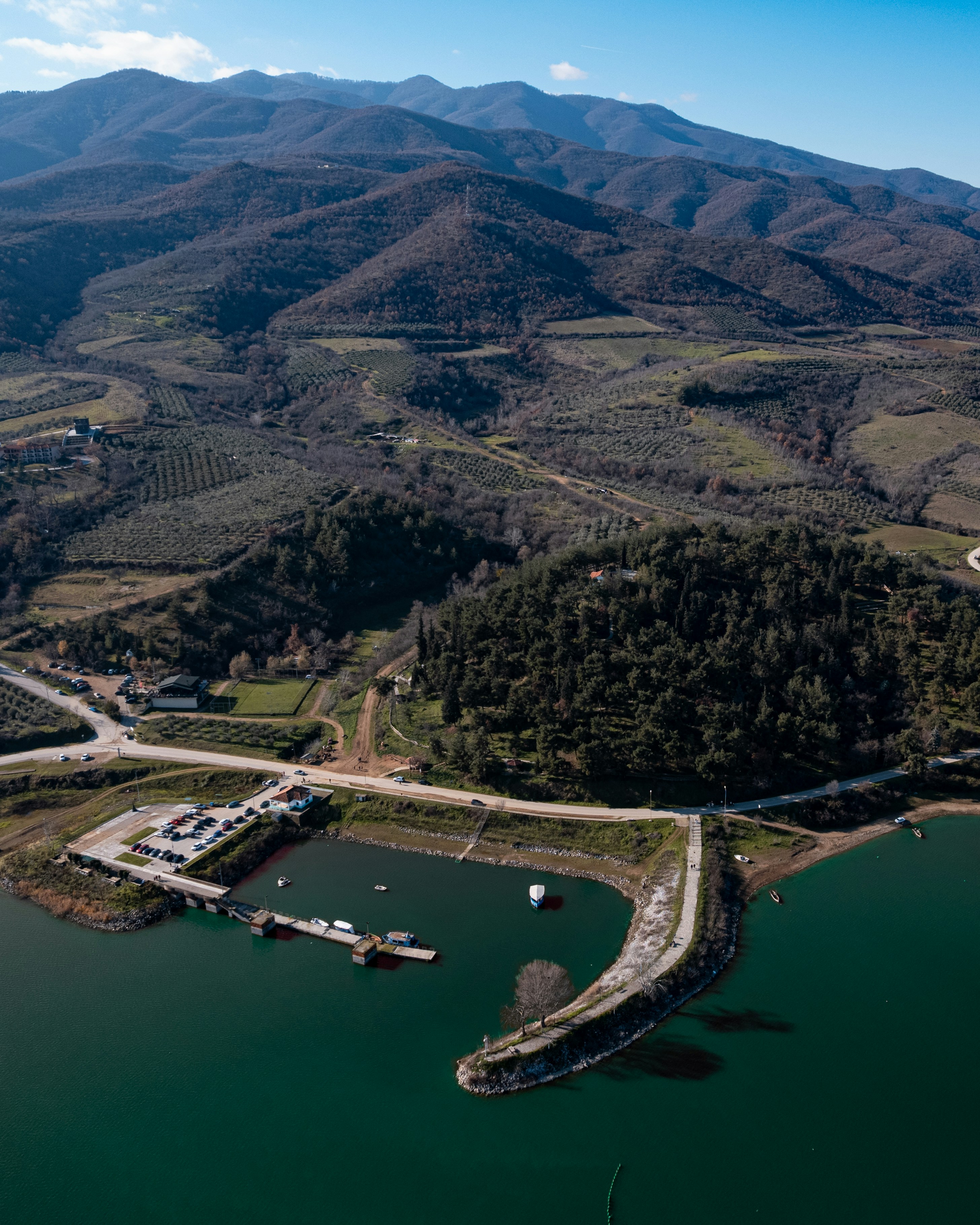 Aerial view of a small harbor and a narrow peninsula on a lake