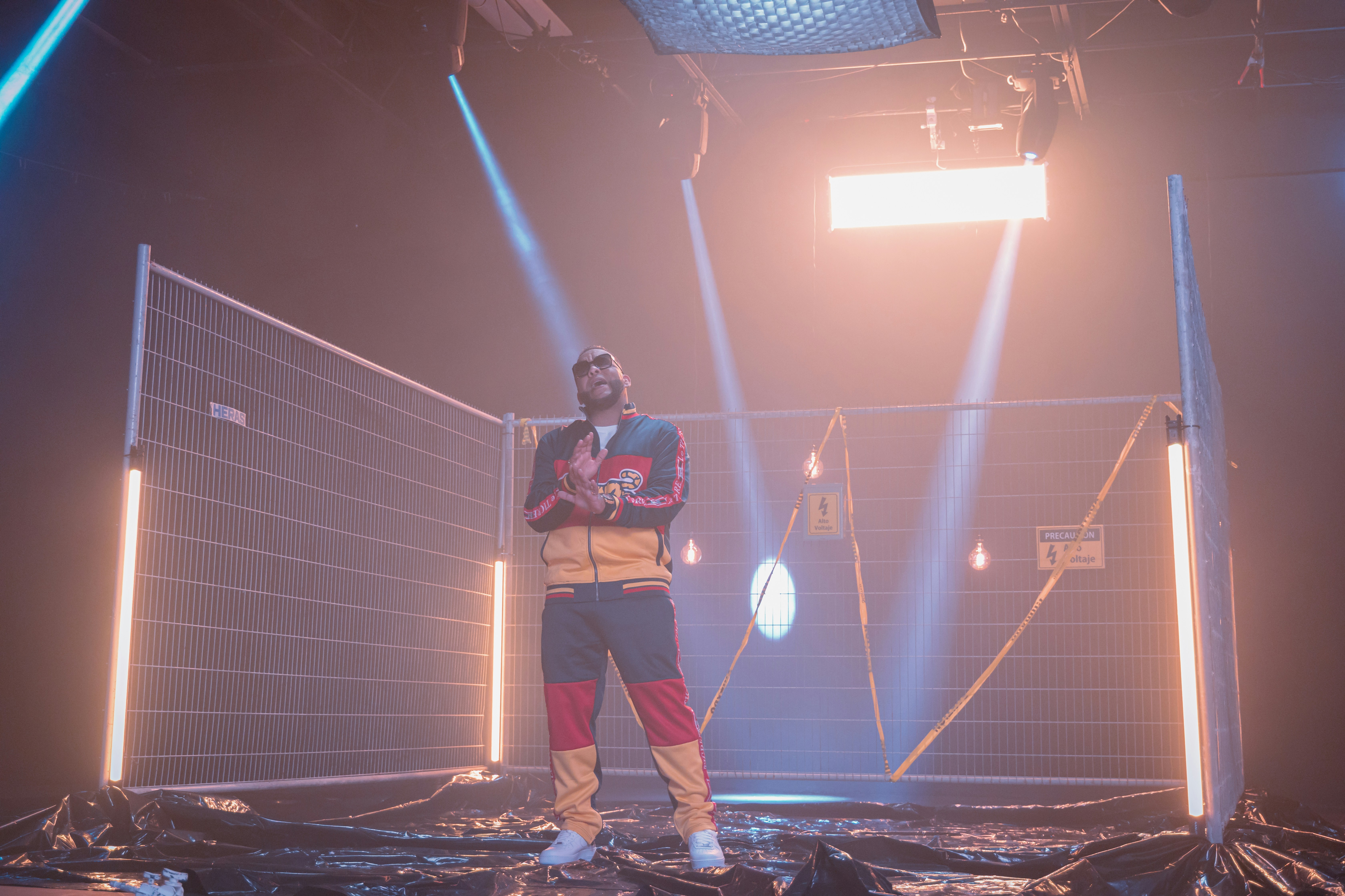 Man in tracksuit inside fenced enclosure - Free Photo on Unsplash