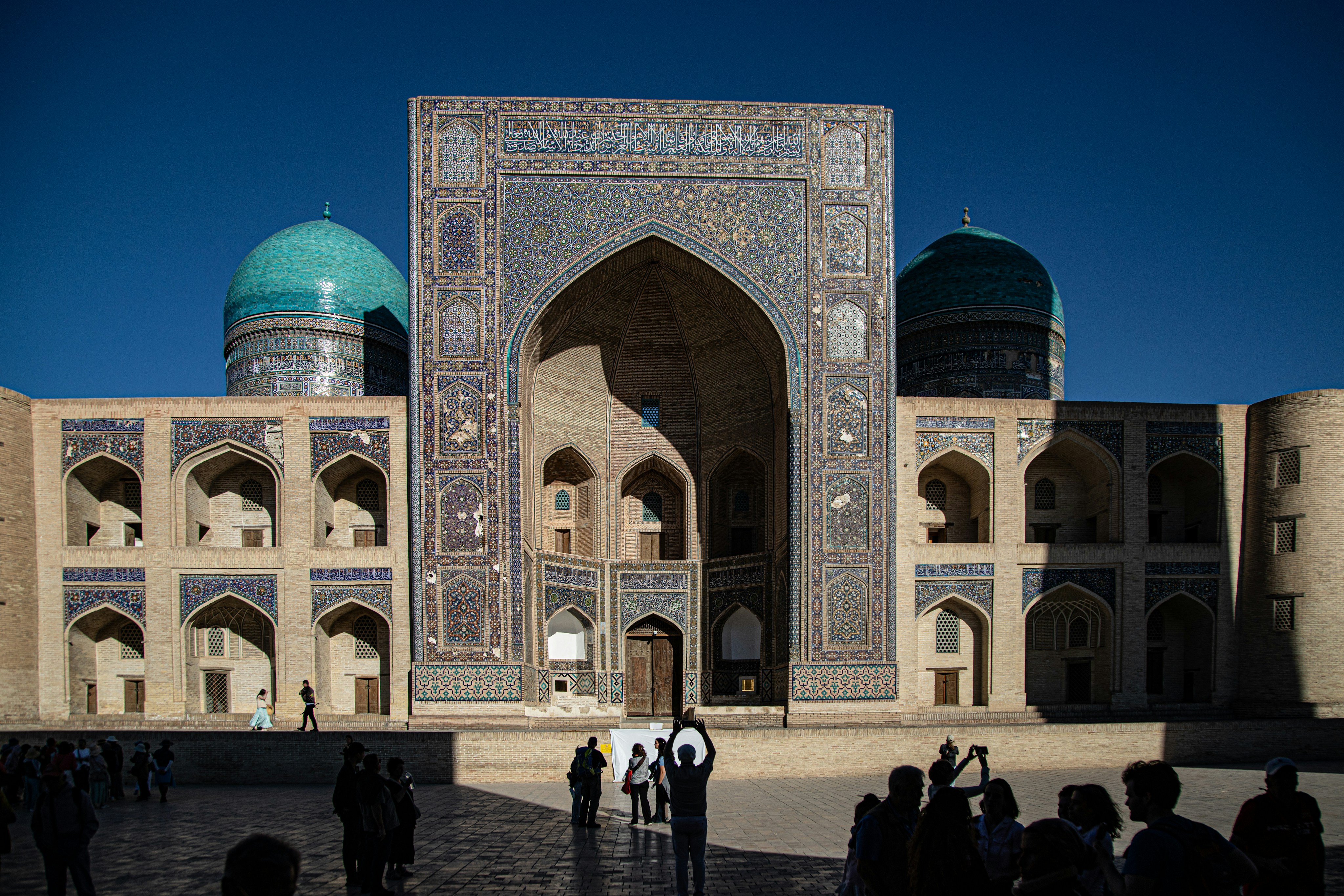 The Mir-i-Arab Madrasah with turquoise domes and intricate tilework in Bukhara, Uzbekistan