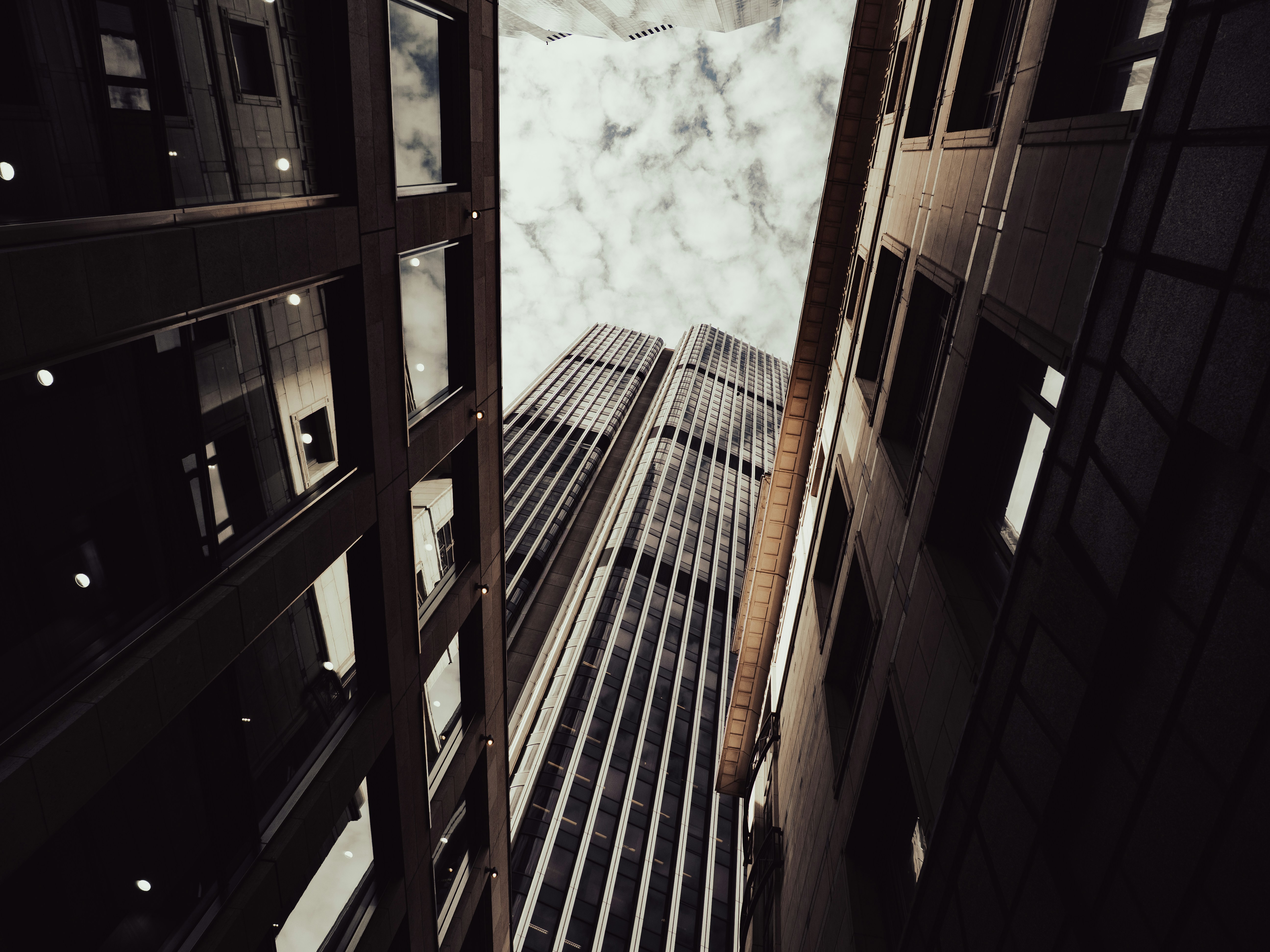 Skyscrapers rising between two buildings - Free Photo on Unsplash