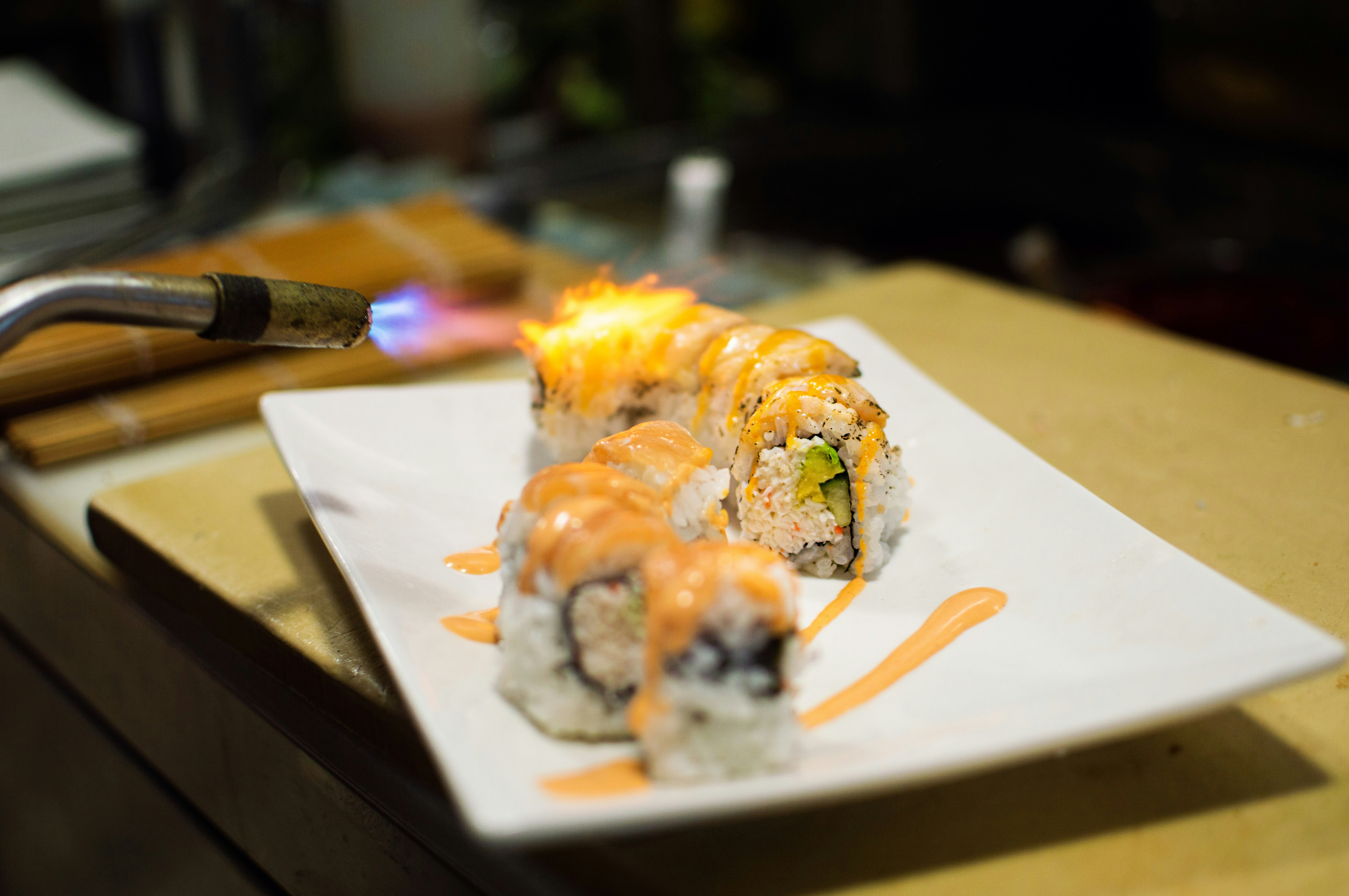 Sushi rolls seared with kitchen torch - Free Photo on Unsplash