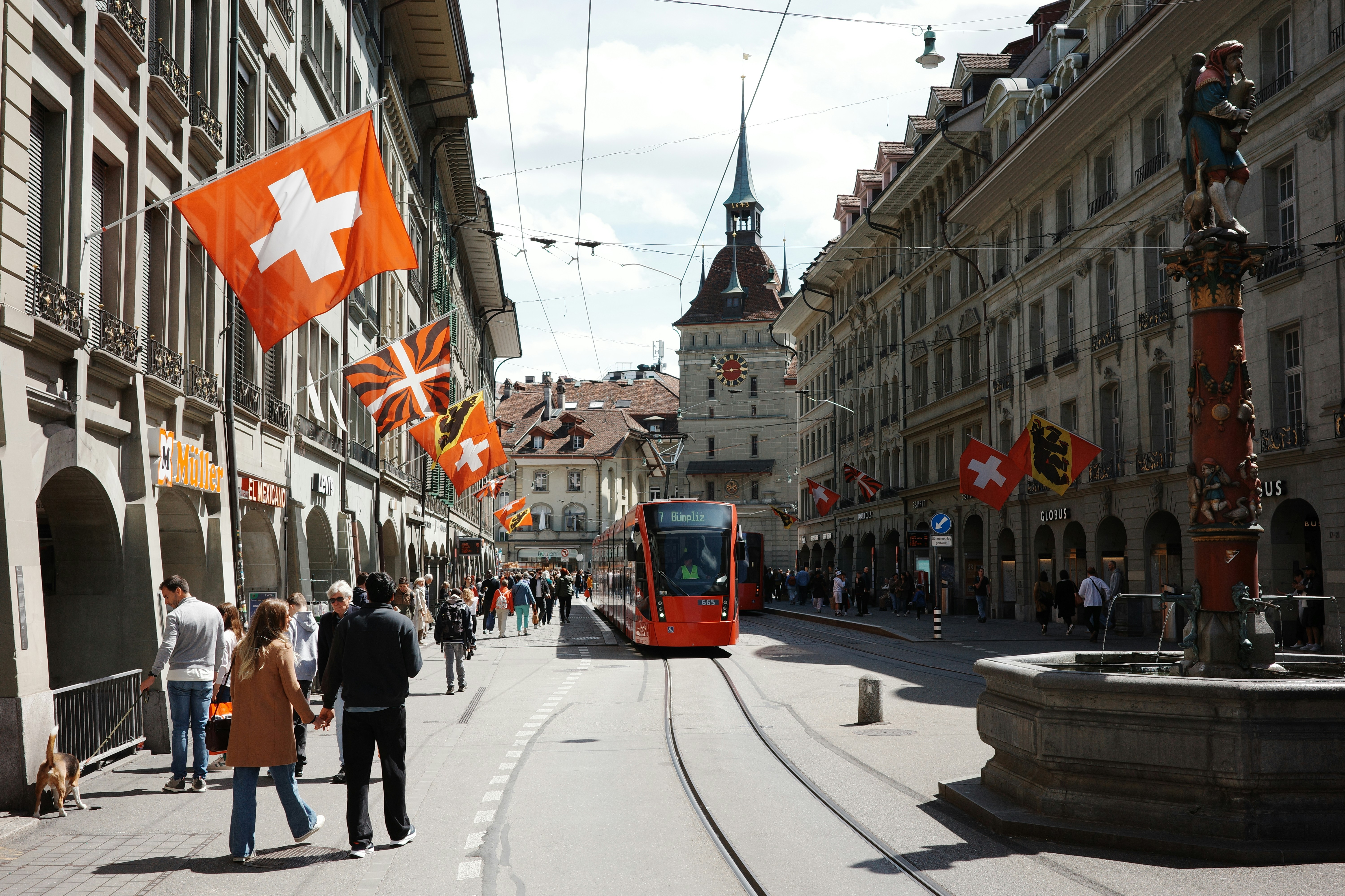 Red tram on street in Bern - Free Photo on Unsplash