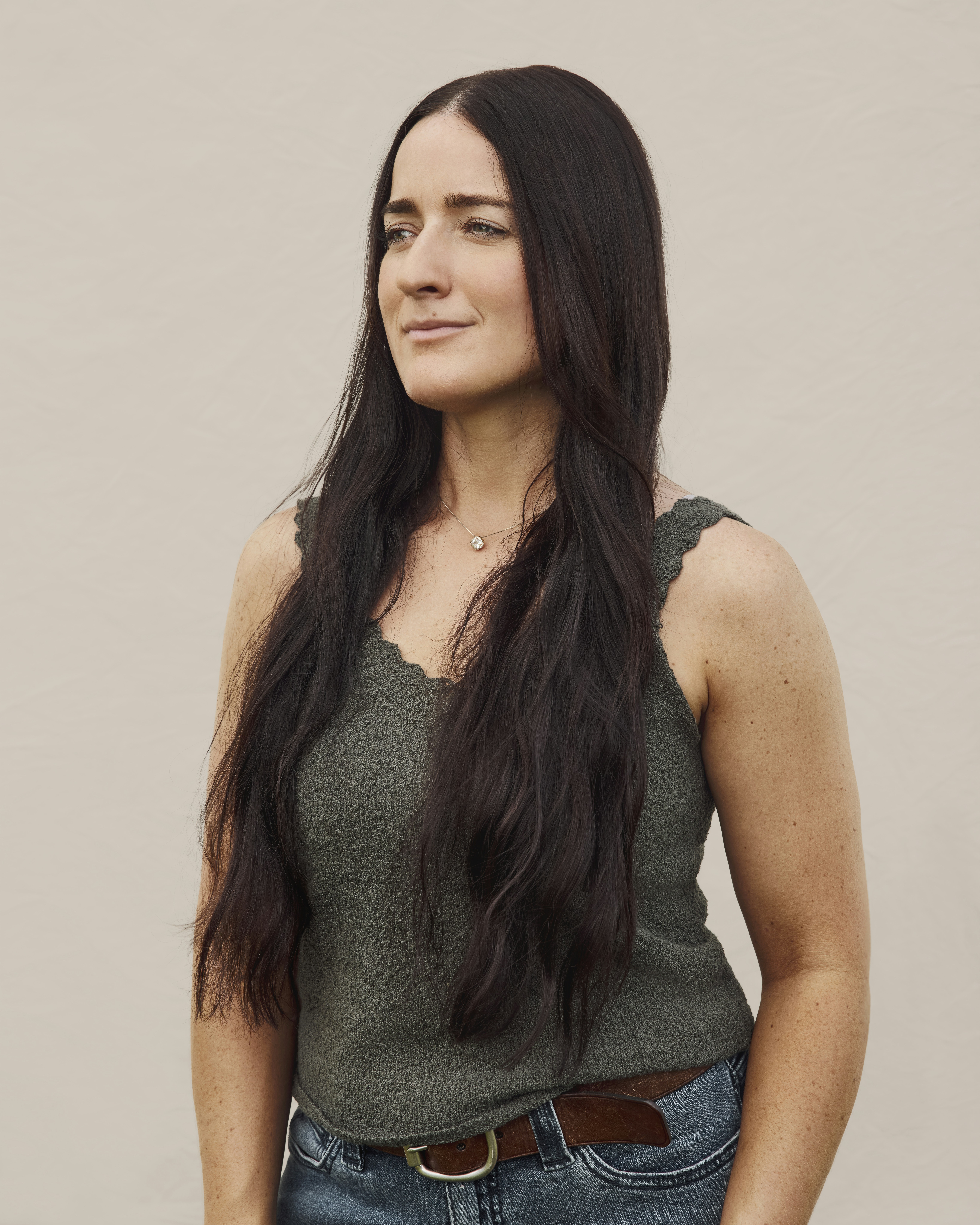 Portrait of a woman against a neutral backdrop
