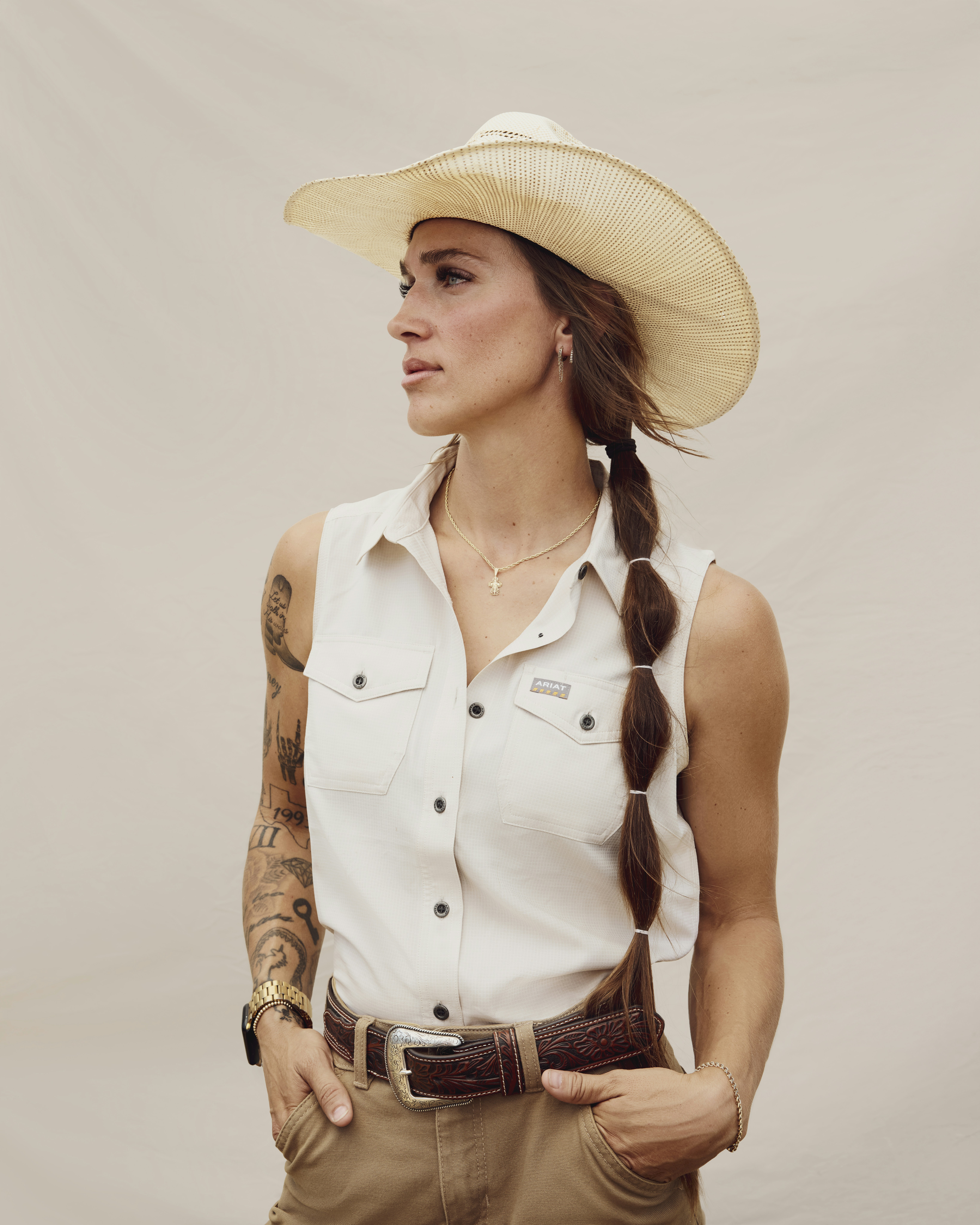 Portrait of a young female farmer wearing a cowboy hat