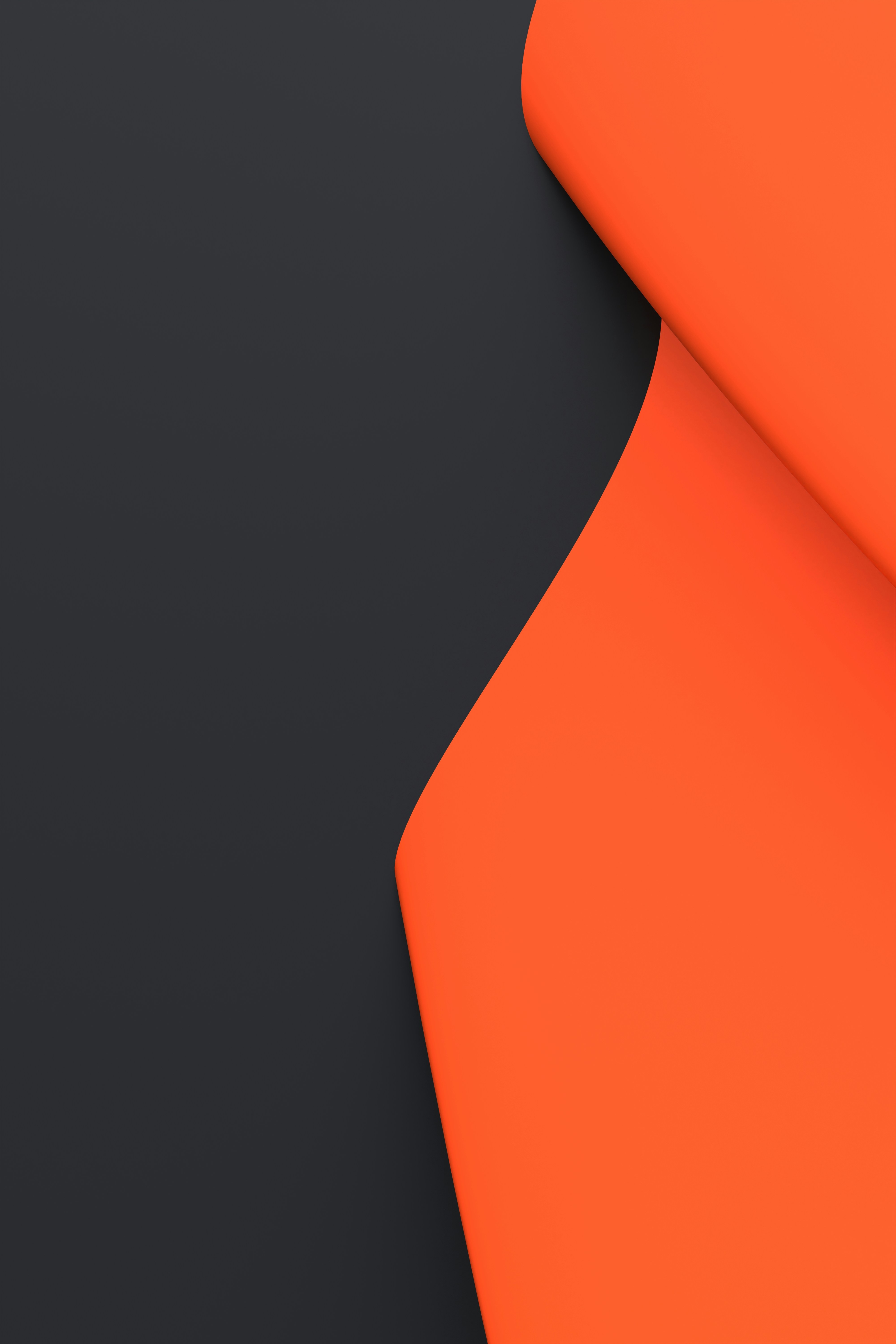 A curved orange shape overlapping a dark grey background