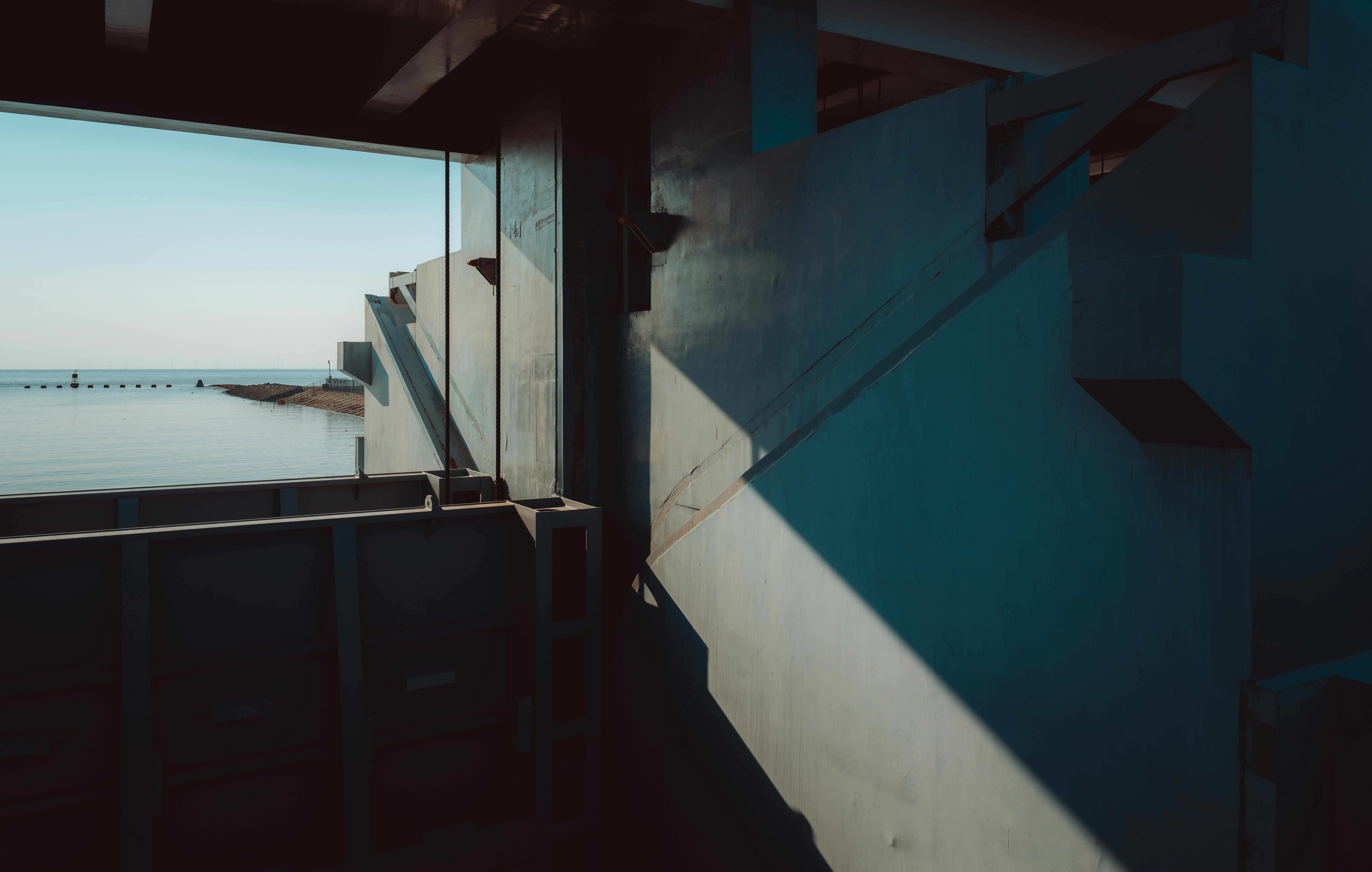 Concrete structure overlooking calm sea - Free Photo on Unsplash