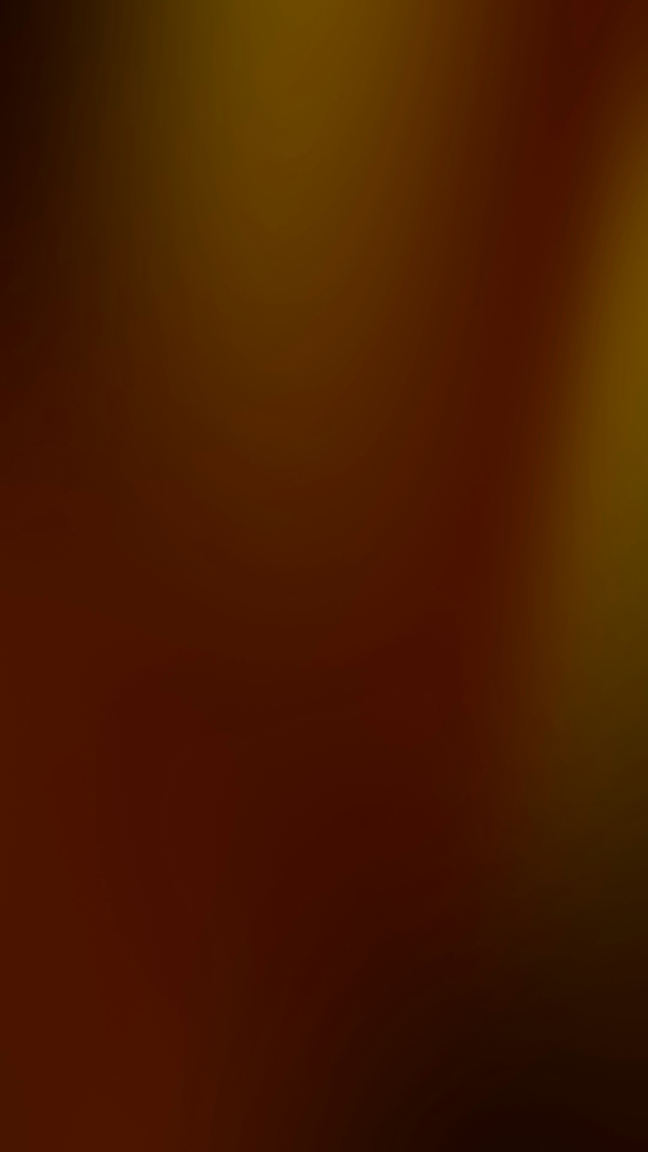 A smooth gradient shifting from dark brown to warm golden yellow