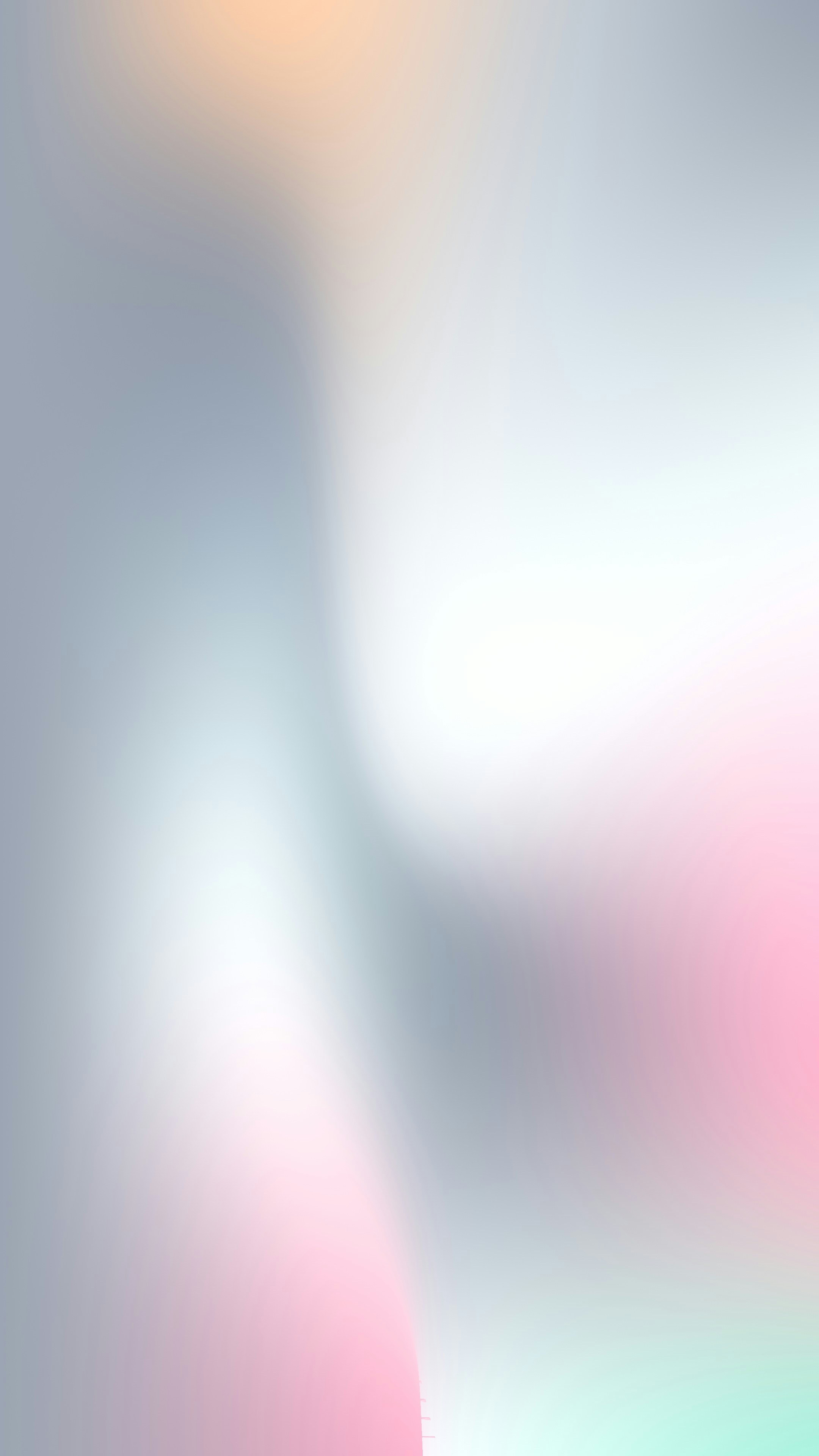 A soft abstract gradient shifting from pale pink to cool grey and white
