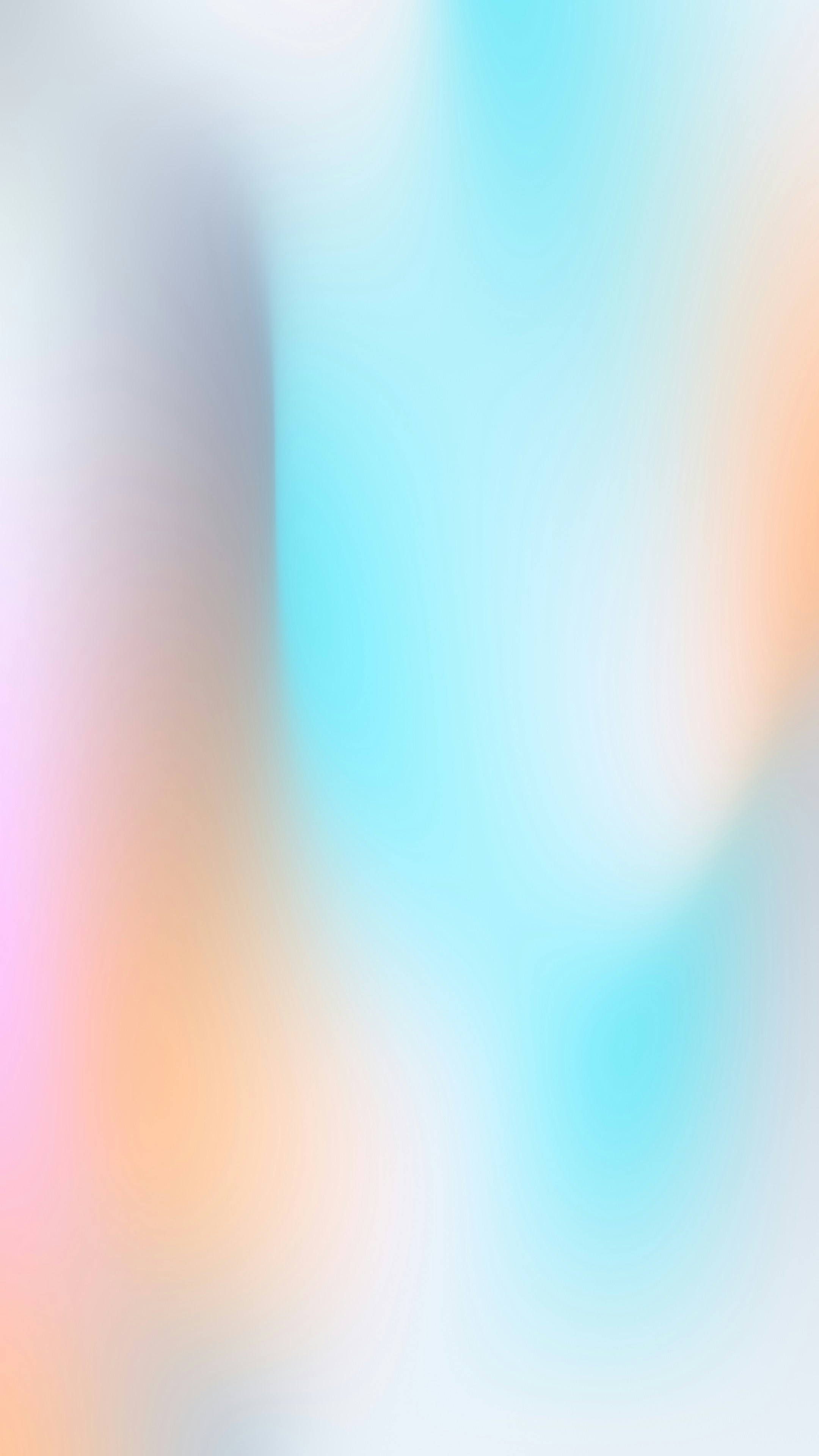 A soft gradient shifting from pale pink to light blue and orange