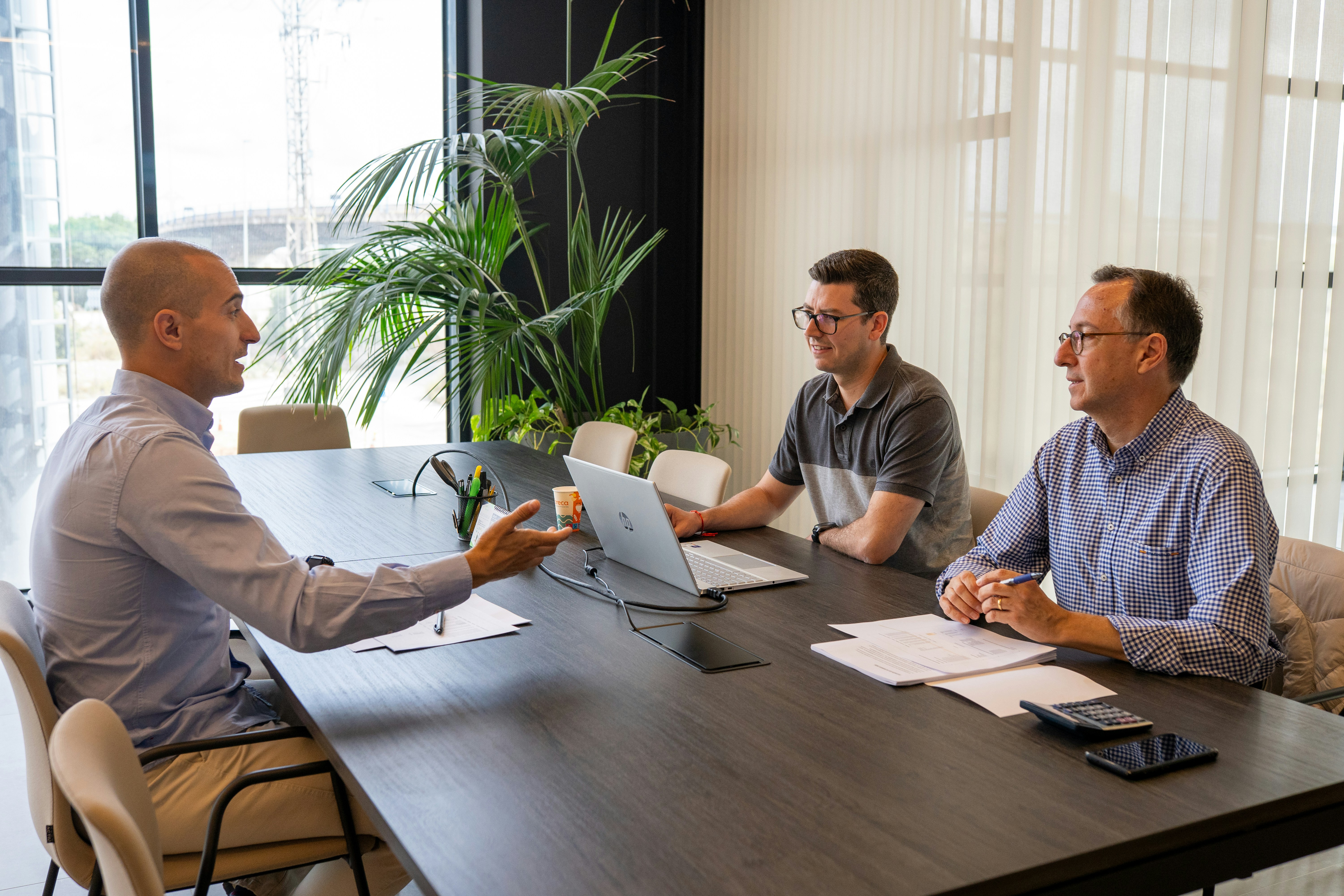 Business handshake marking a partnership agreement in a boardroom