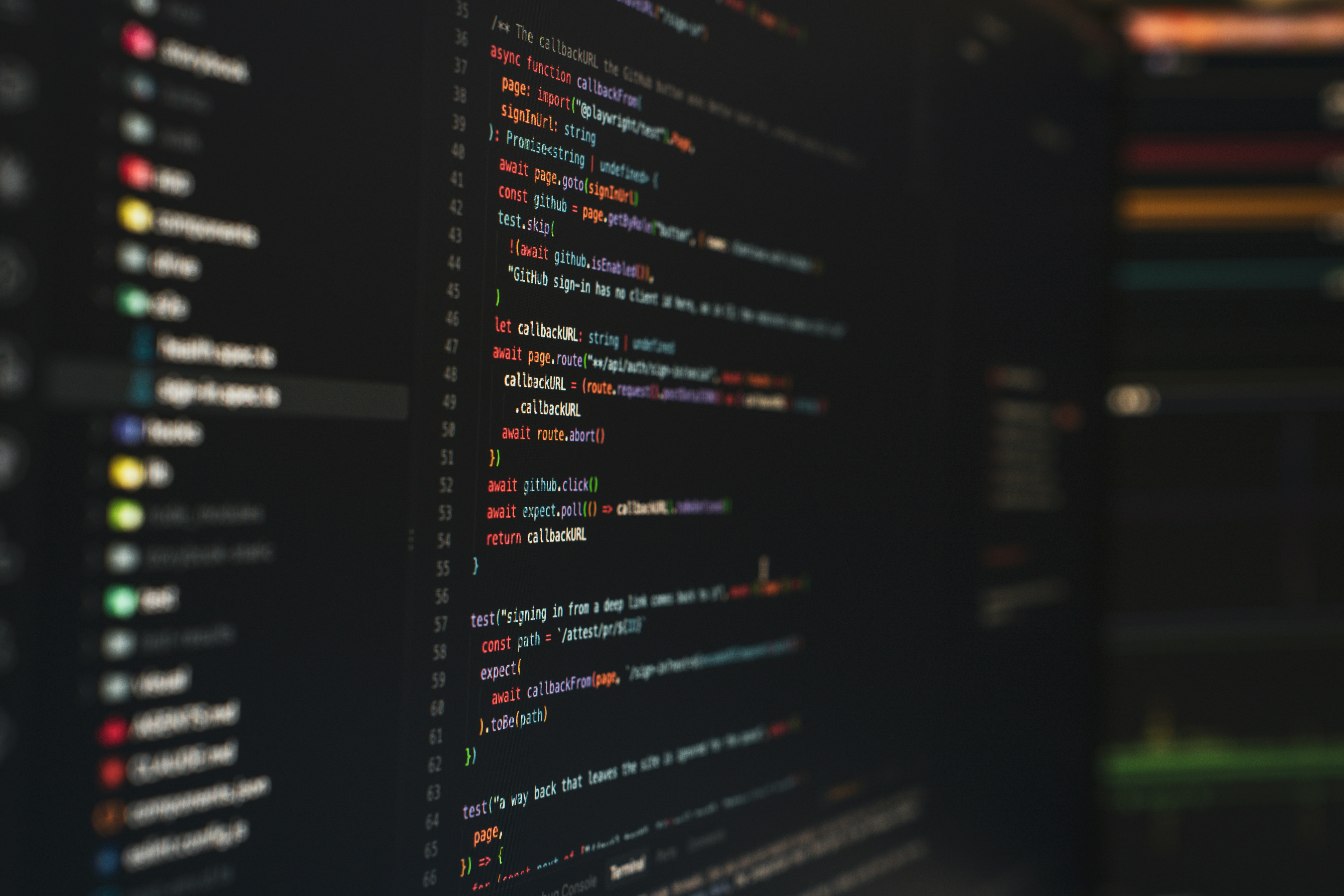Lines of colorful programming code displayed on a dark computer screen