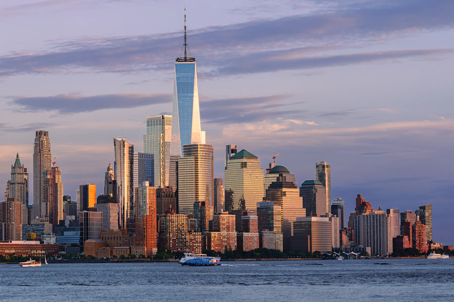 Lower Manhattan and One World Trade Center across the Hudson River at golden hour