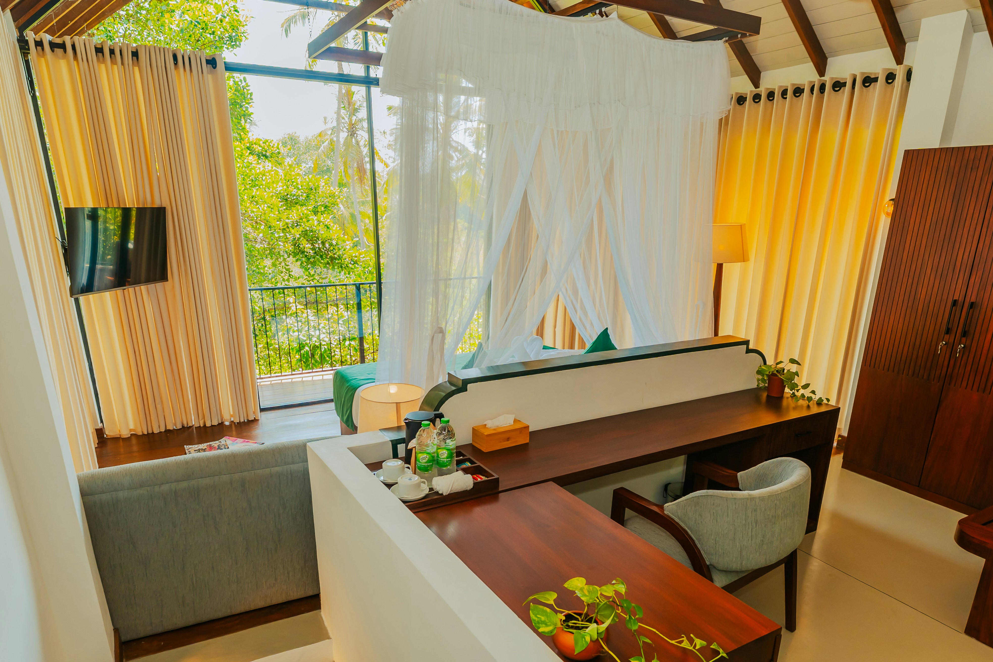 Room with a desk and balcony