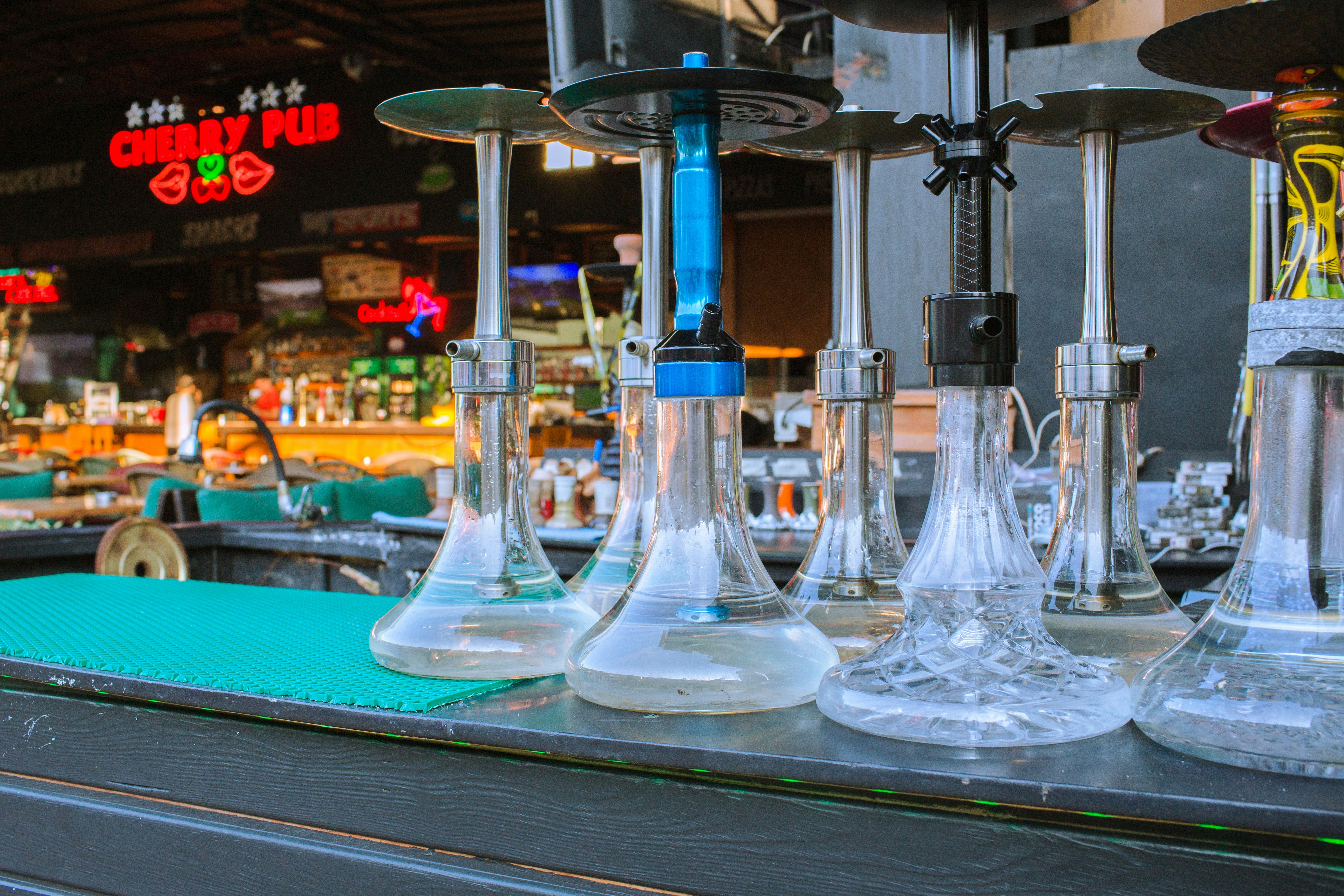 Glass hookahs on bar counter - Free Photo on Unsplash