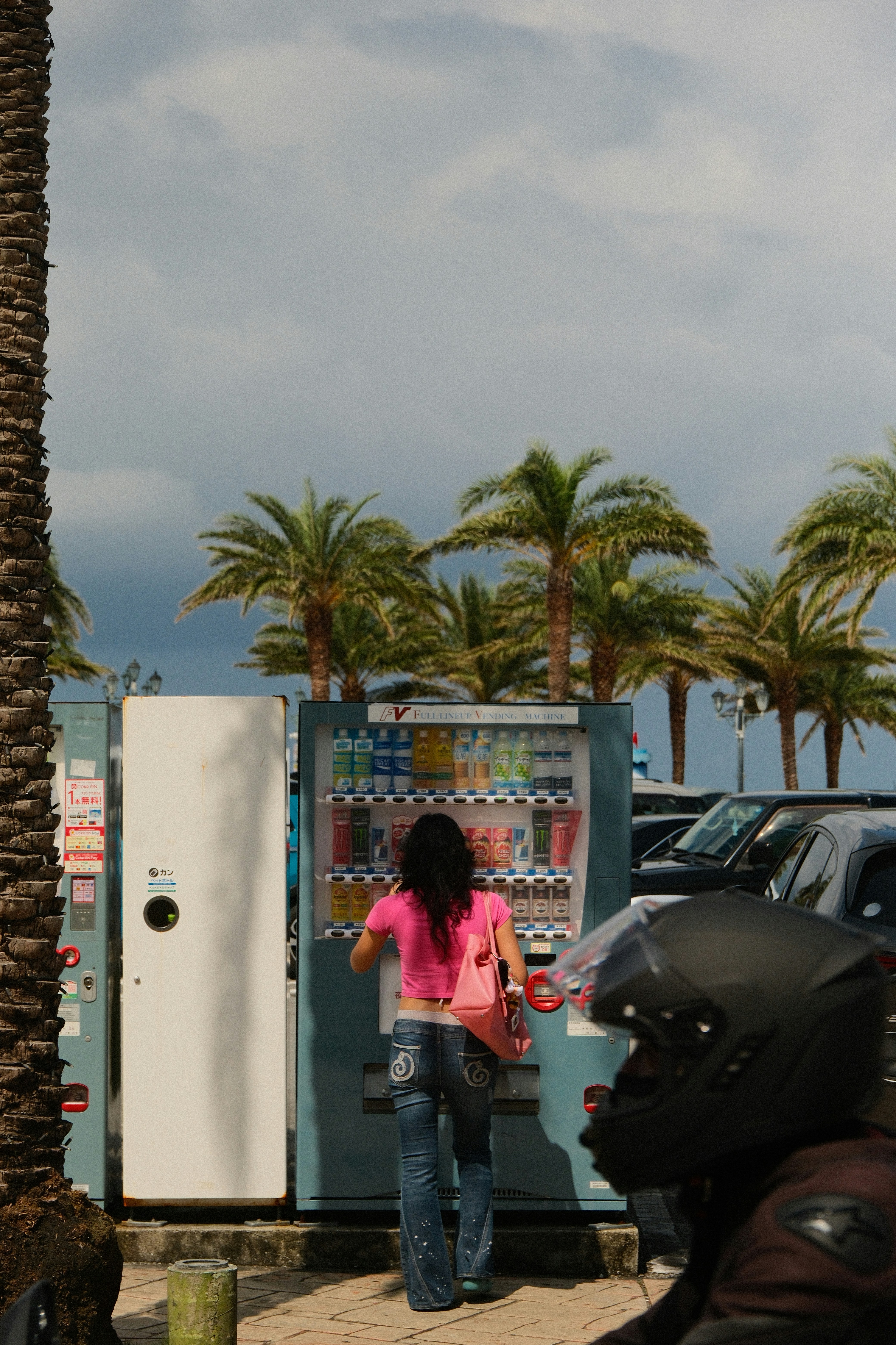 Woman using outdoor vending machine - Free Photo on Unsplash