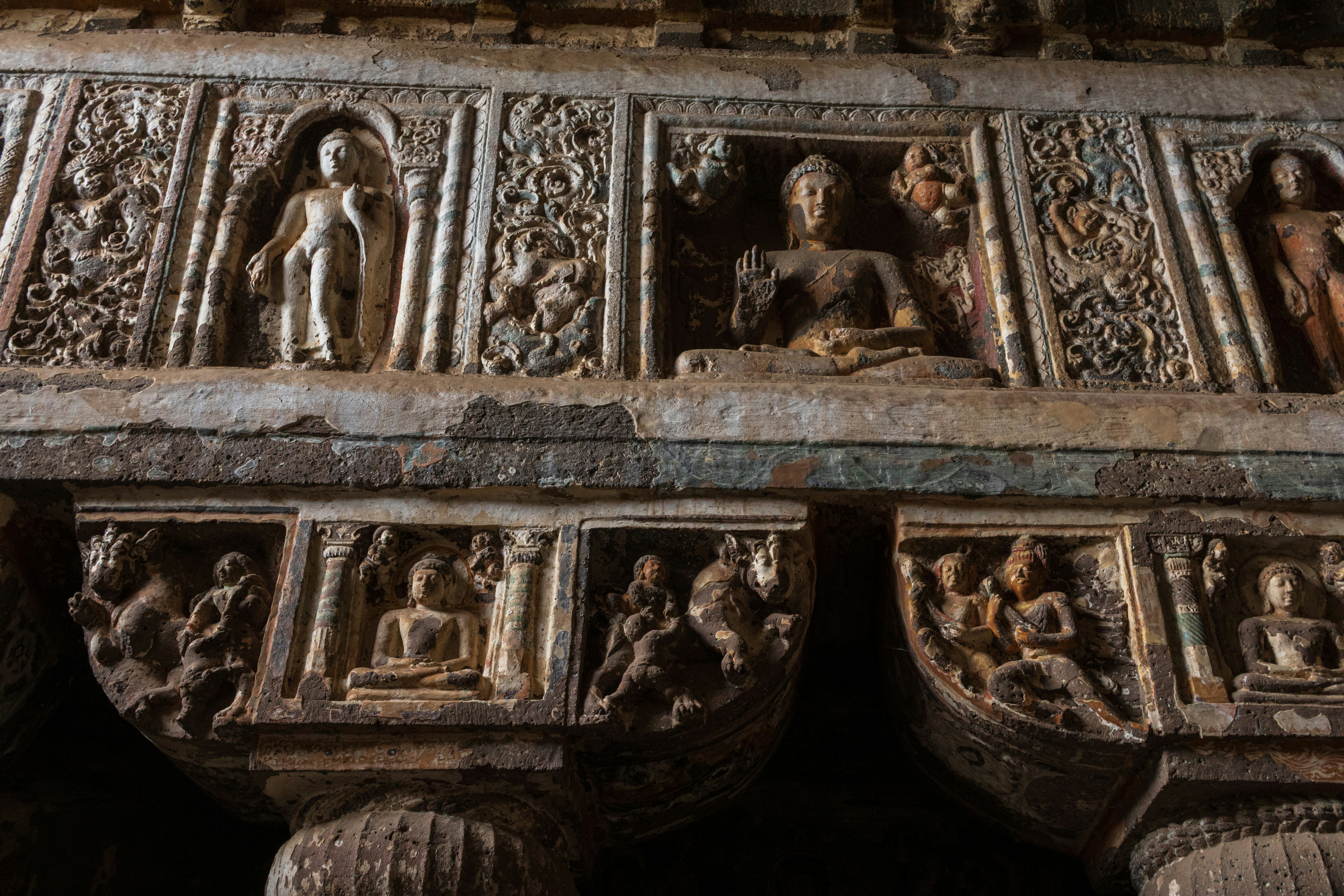 Rock-cut Buddha reliefs and ornate carvings inside Cave 19 of the Ajanta Caves in Maharashtra, India