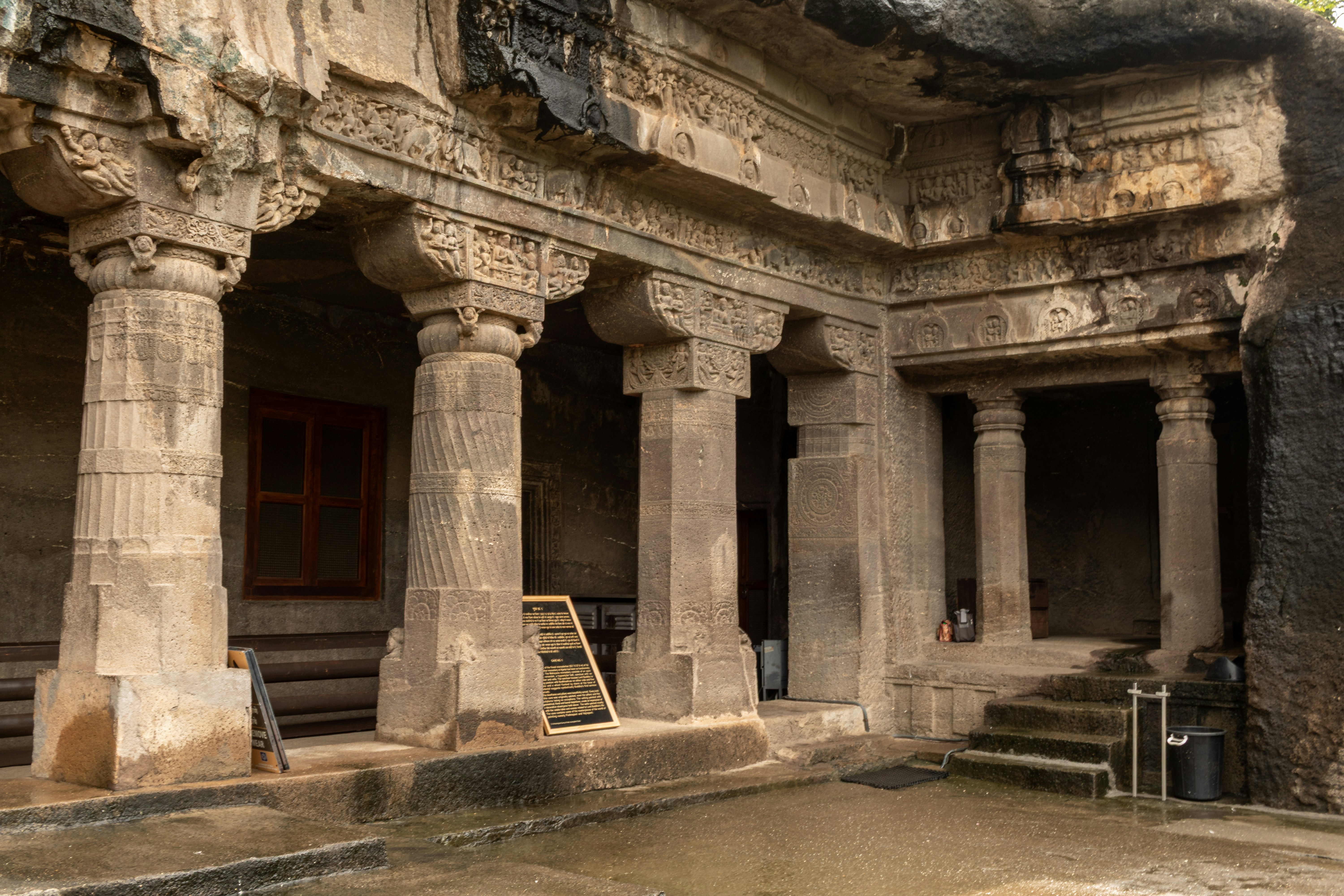 The pillared veranda and ornate stone carvings of Cave 1 at the Ajanta Caves in Maharashtra, India