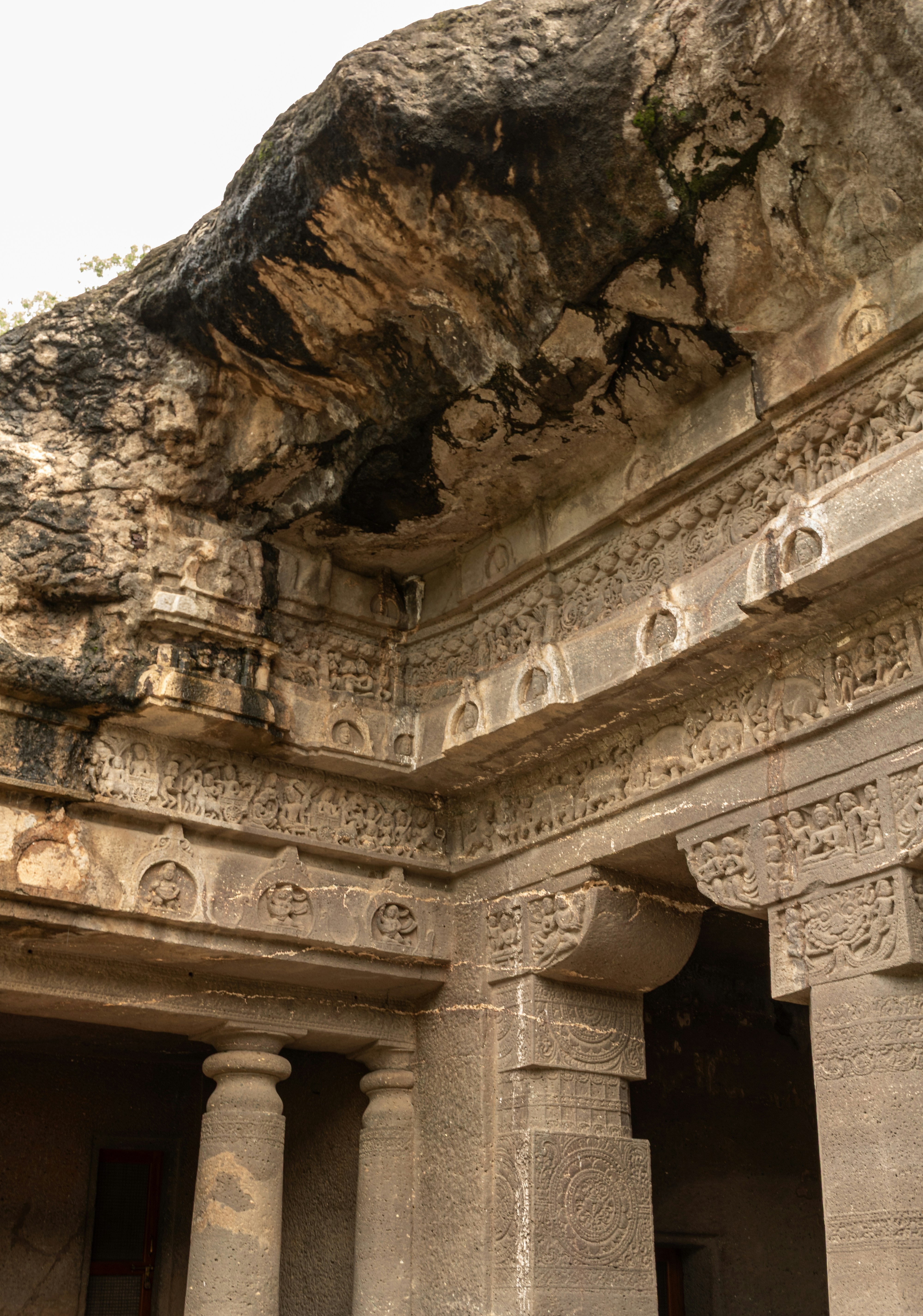 The ornate stone carvings and pillars of Cave 1 at the Ajanta Caves in Maharashtra, India